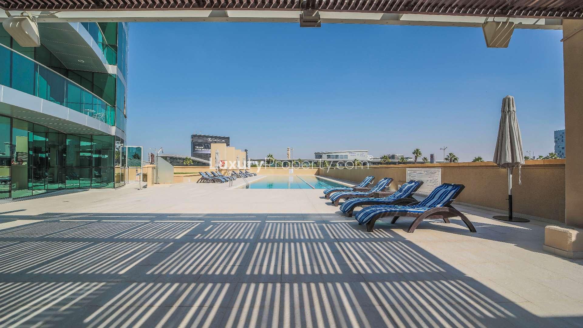 Spacious dining and living area with floor-to-ceiling windows, Marsa Plaza, Dubai Festival City