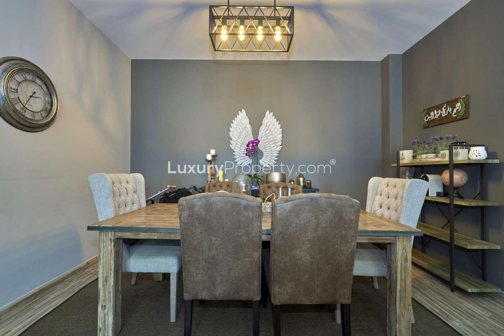 Living room in 4-bed apartment, Masakin Al Furjan, with modern decor and lighting