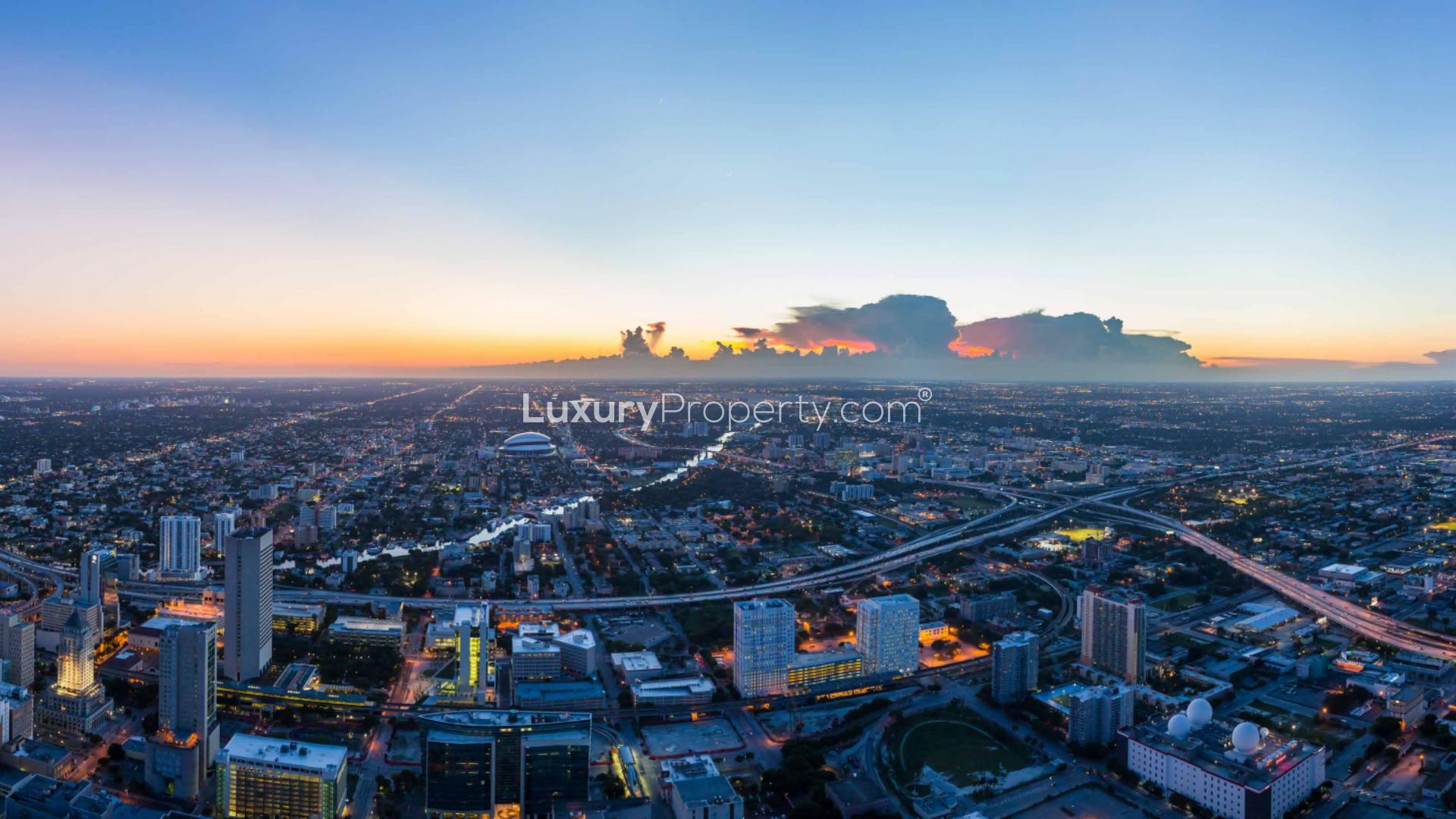 Contemporary Miami apartment living room with city skyline view at Waldorf Astoria