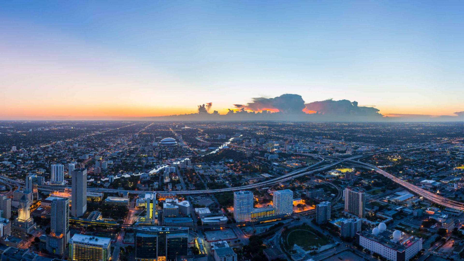 Contemporary Miami apartment living room with city skyline view at Waldorf Astoria