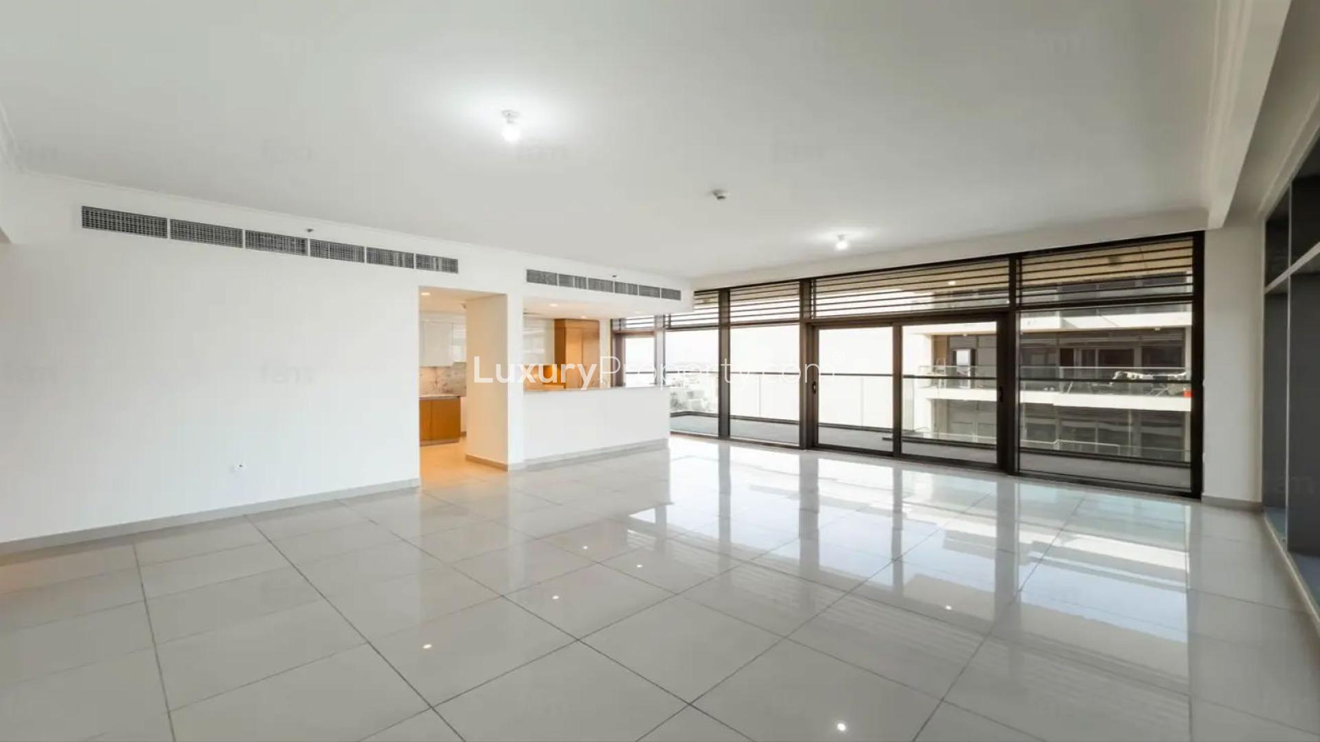 Bright, spacious living room with large windows in Dubai Hills Estate apartment for sale