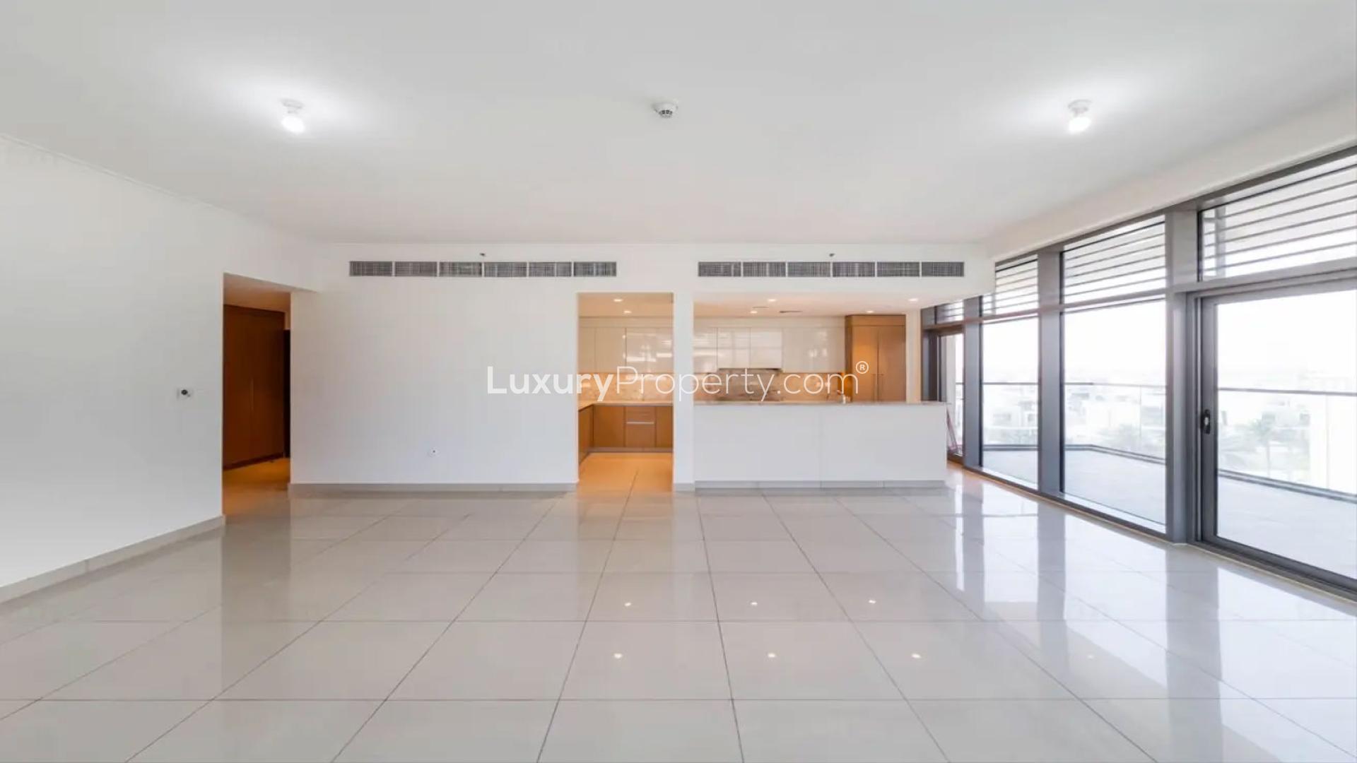 Bright living area in 3-bed apartment, Dubai Hills Estate, with large windows and pool views