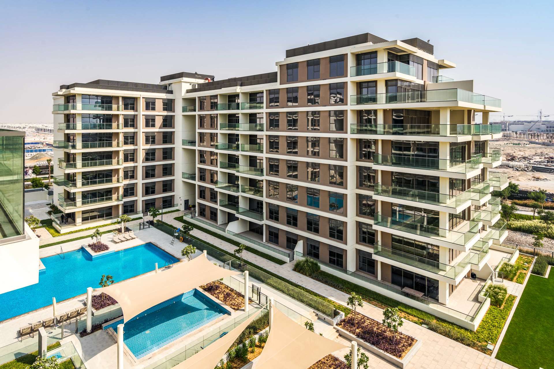 Open-plan living room and kitchen in Mulberry Park Heights apartment, Dubai Hills Estate