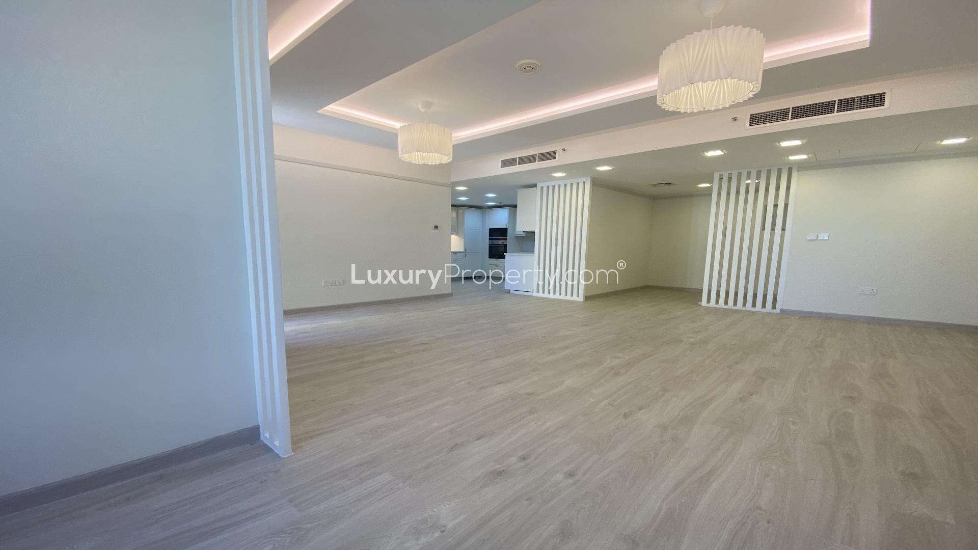 "Spacious living area in upgraded Jumeirah Beach Residence apartment, Murjan, for sale.",Bright, modern kitchen in fully upgraded 3-bedroom apartment, Murjan, Jumeirah Beach Residence