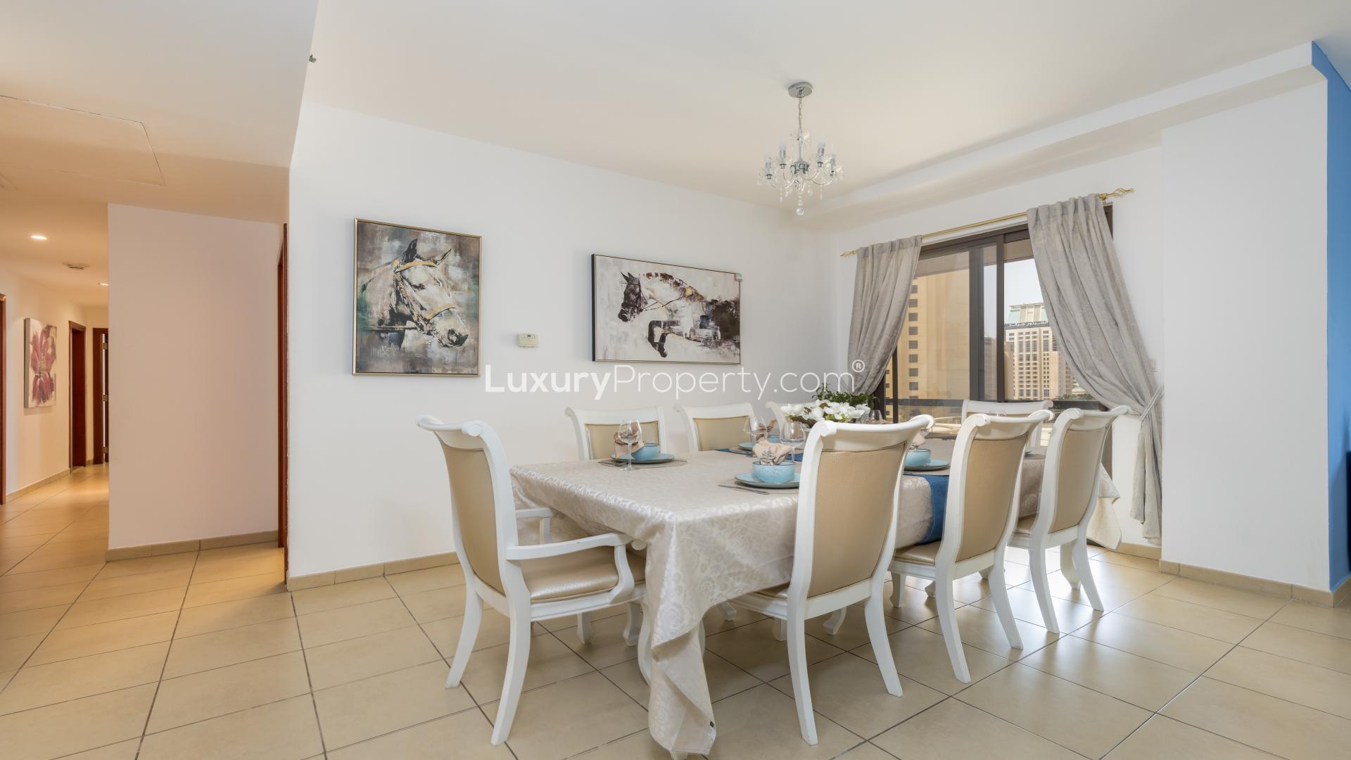 Beautifully furnished living room in Jumeirah Beach Residence apartment, featuring modern decor and views