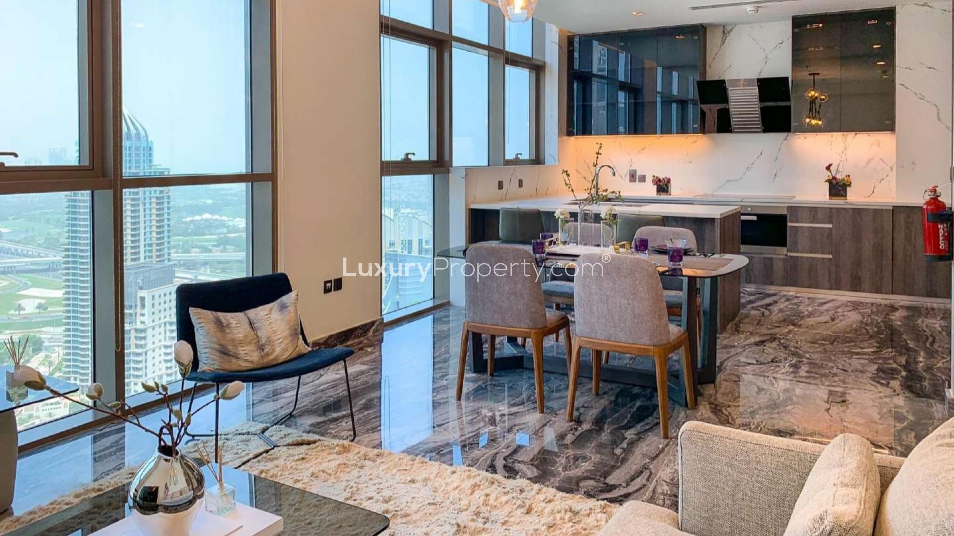 "Dubai Marina apartment balcony with stunning views, three-bedroom property for sale.",Modern Dubai Marina apartment interior with elegant dining area and stunning city views