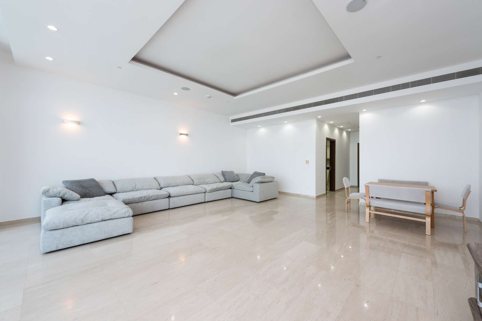 High-floor apartment living room with large windows, Palm Jumeirah views, Oceana community