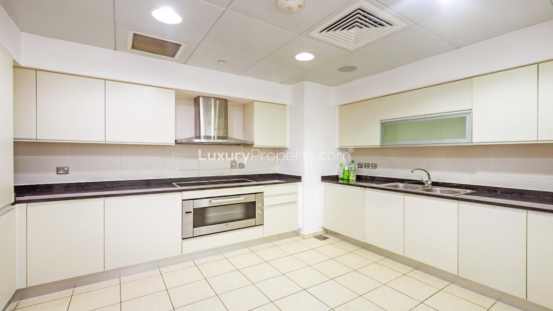 Spacious living area in Palm Jumeirah apartment, featuring modern design and ample seating