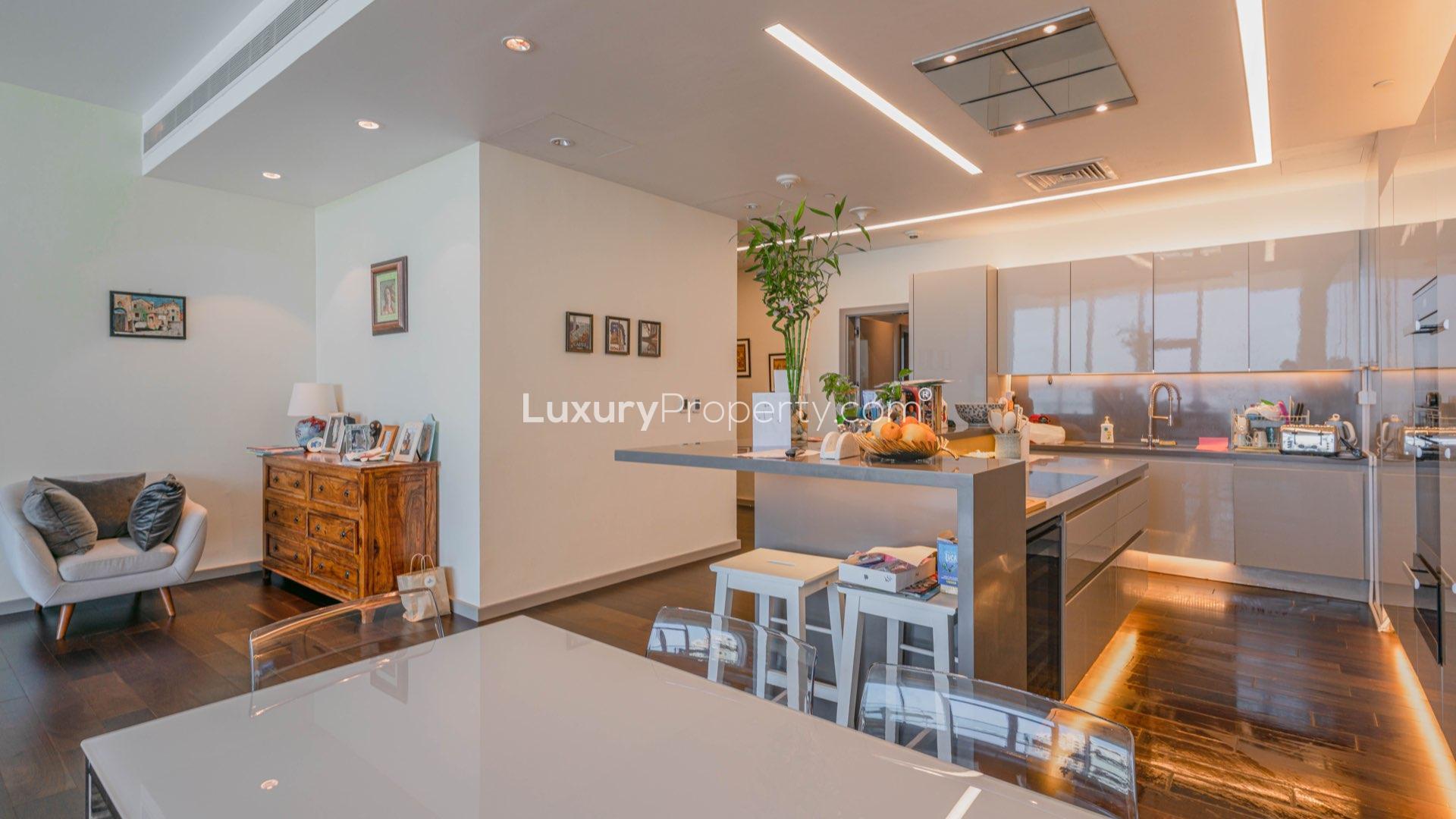 Modern kitchen in high-floor Atlantis-facing apartment, Palm Jumeirah, Oceana. Sleek cabinetry, island