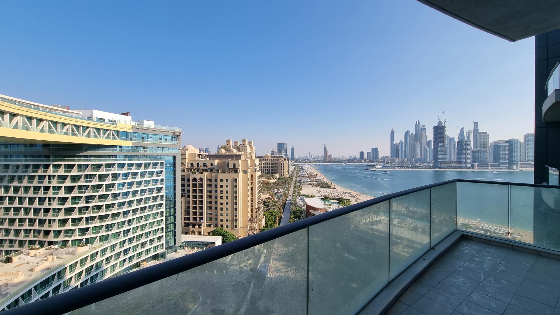 Modern living room in Palm Jumeirah apartment, featuring elegant decor and spacious layout