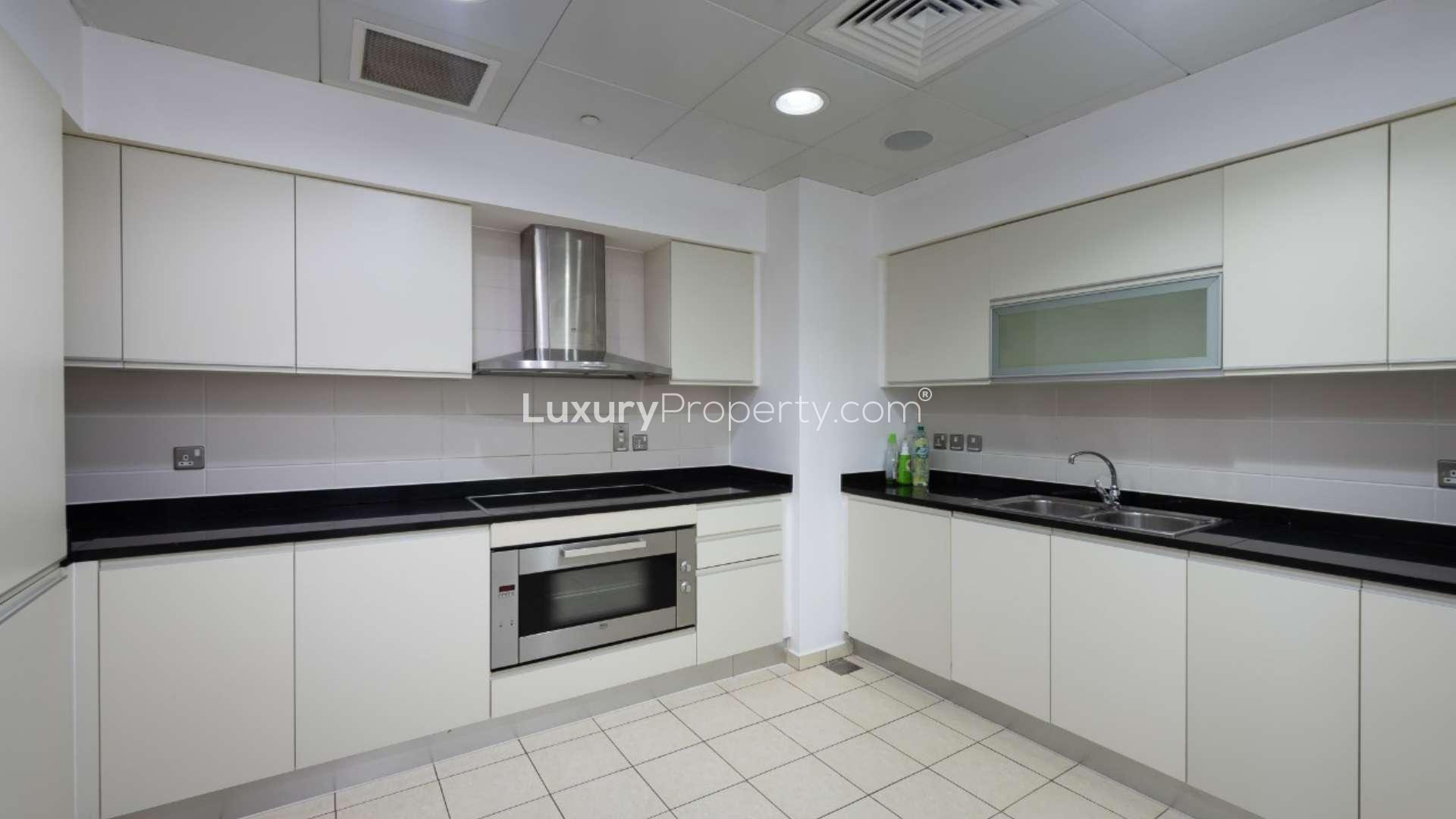 N/A,Spacious living room in 3-bedroom apartment, Oceana, Palm Jumeirah, featuring modern decor and lighting
