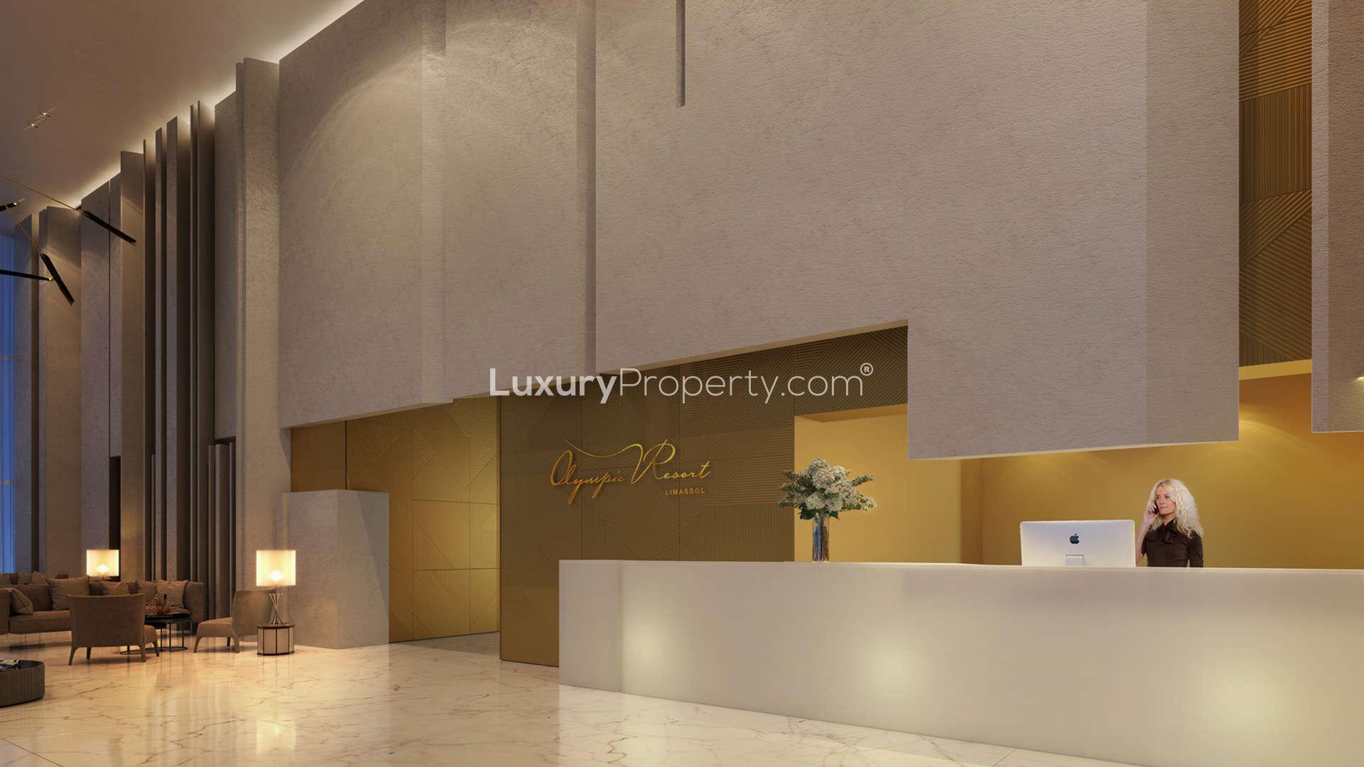 "Modern luxury apartment entrance at Olympic Resort, Limassol with sleek architecture and elegant design.",Luxurious lobby interior of Olympic Resort apartment, Limassol, Cyprus, with modern reception desk