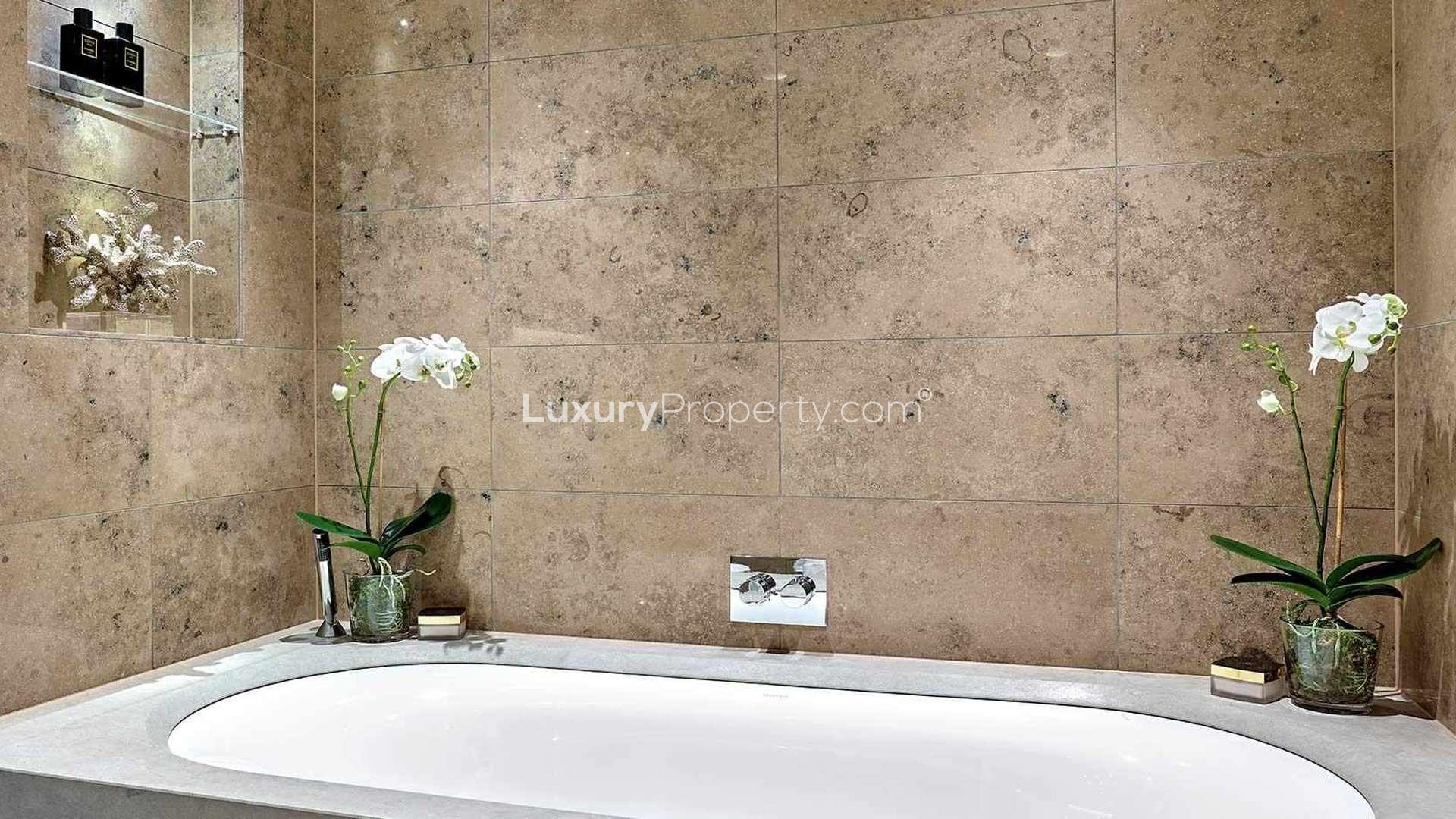 Luxury bedroom in One Blackfriars apartment, Southwark, featuring elegant decor and plush bedding