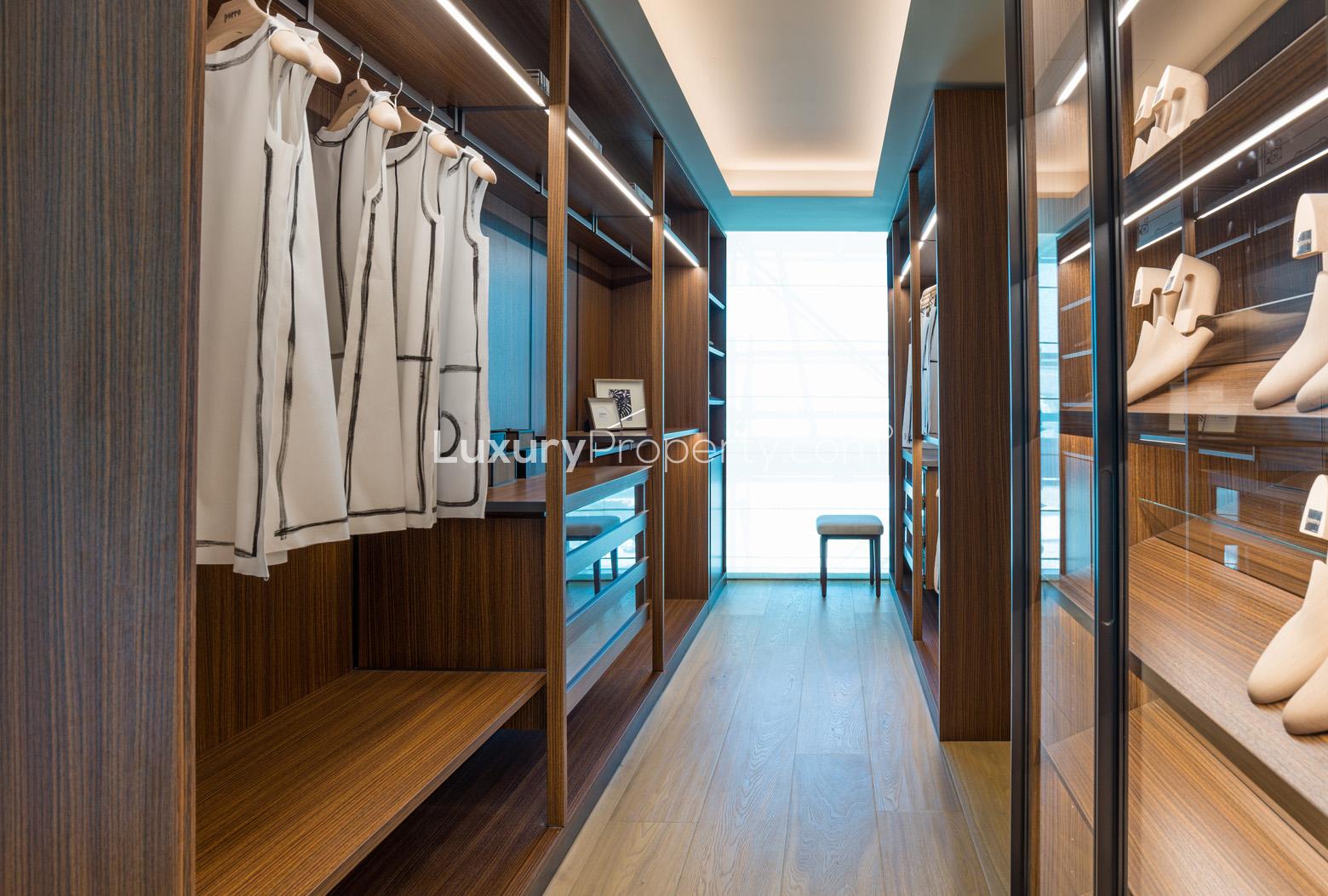 "Elegant hallway with wooden shelving, Three Bedroom Apartment, One Palm, Palm Jumeirah for sale.",Luxurious walk-in closet in three-bedroom apartment, One Palm, Palm Jumeirah, for sale