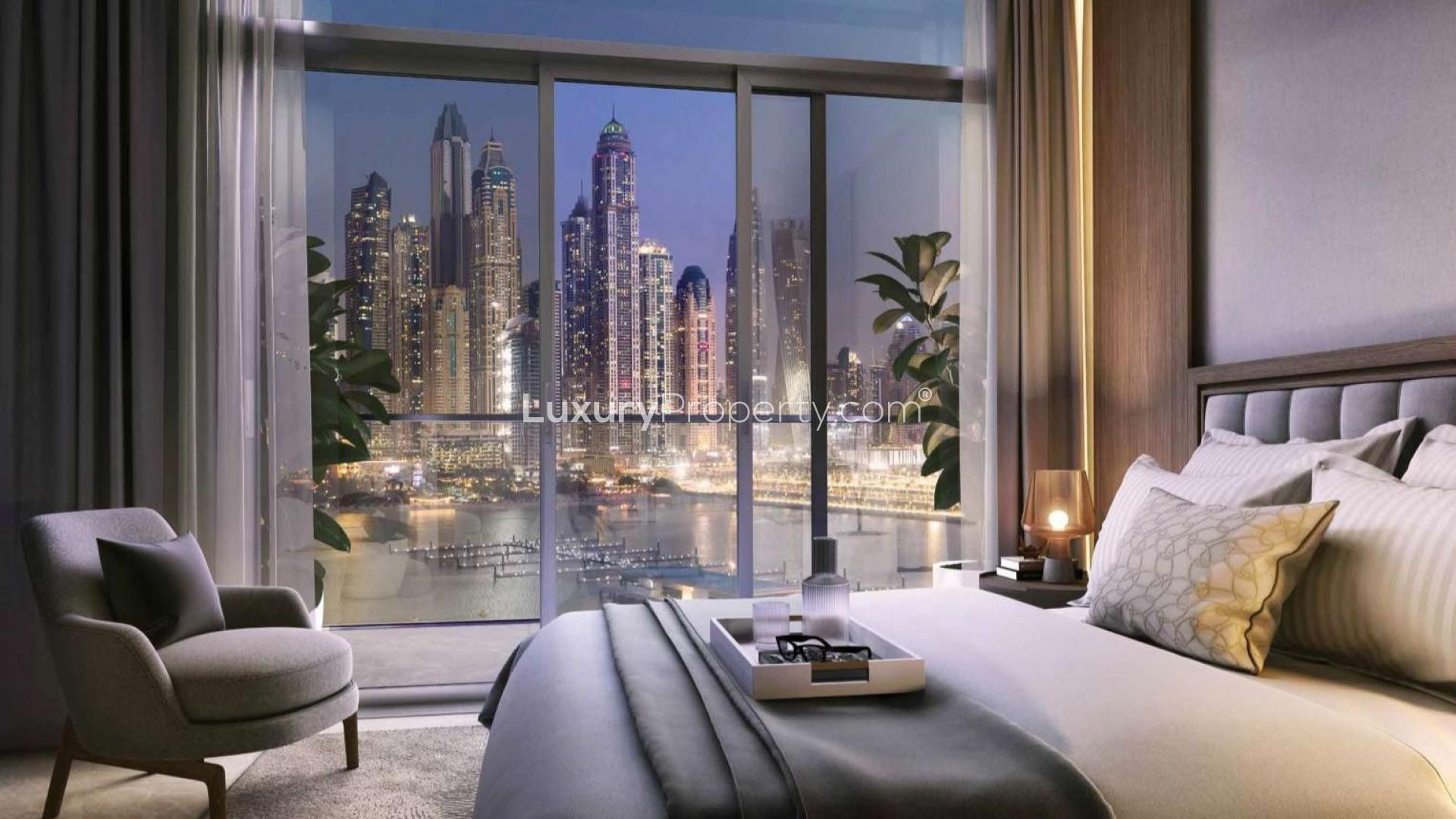 Modern apartment balcony view of Dubai Harbour, Emaar Beachfront, with marina and skyscrapers