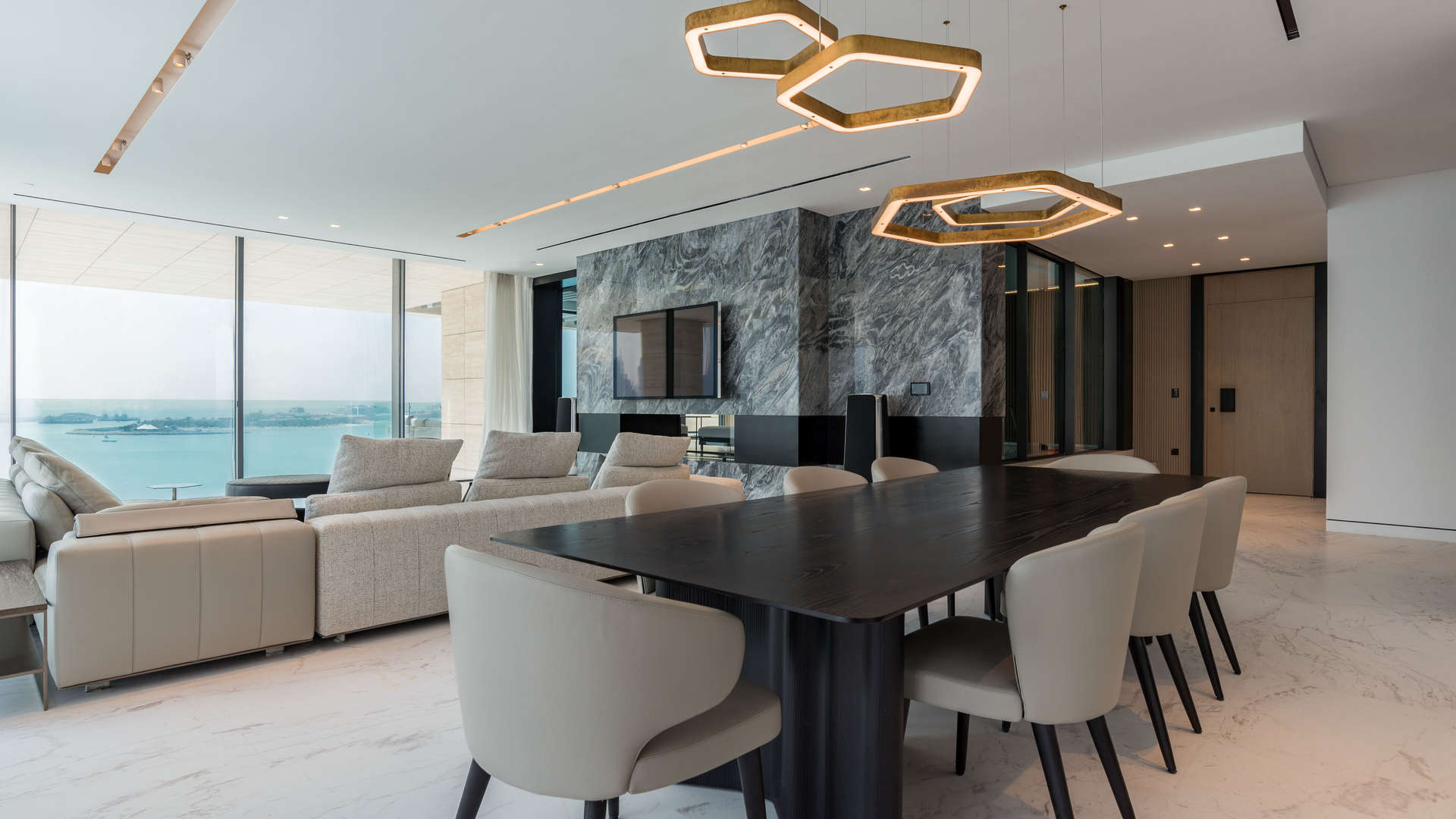 "Elegant entrance of Palme Couture beachfront apartment, Palm Jumeirah, Dubai for sale.",Luxurious beachfront apartment interior with ocean view in Palme Couture, Palm Jumeirah, Dubai