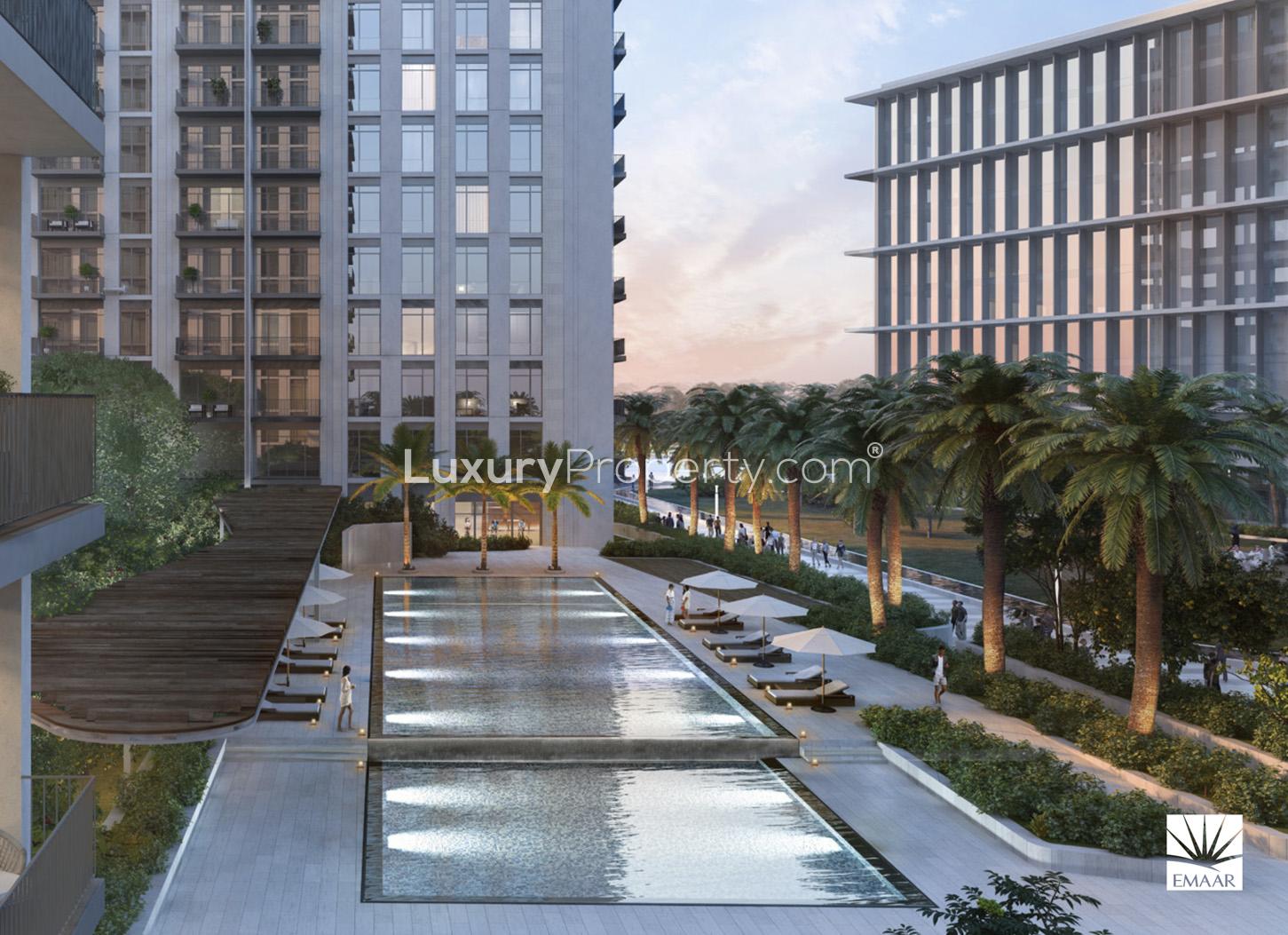 Outdoor infinity pool view from gym at Park Heights, Dubai Hills Estate apartment