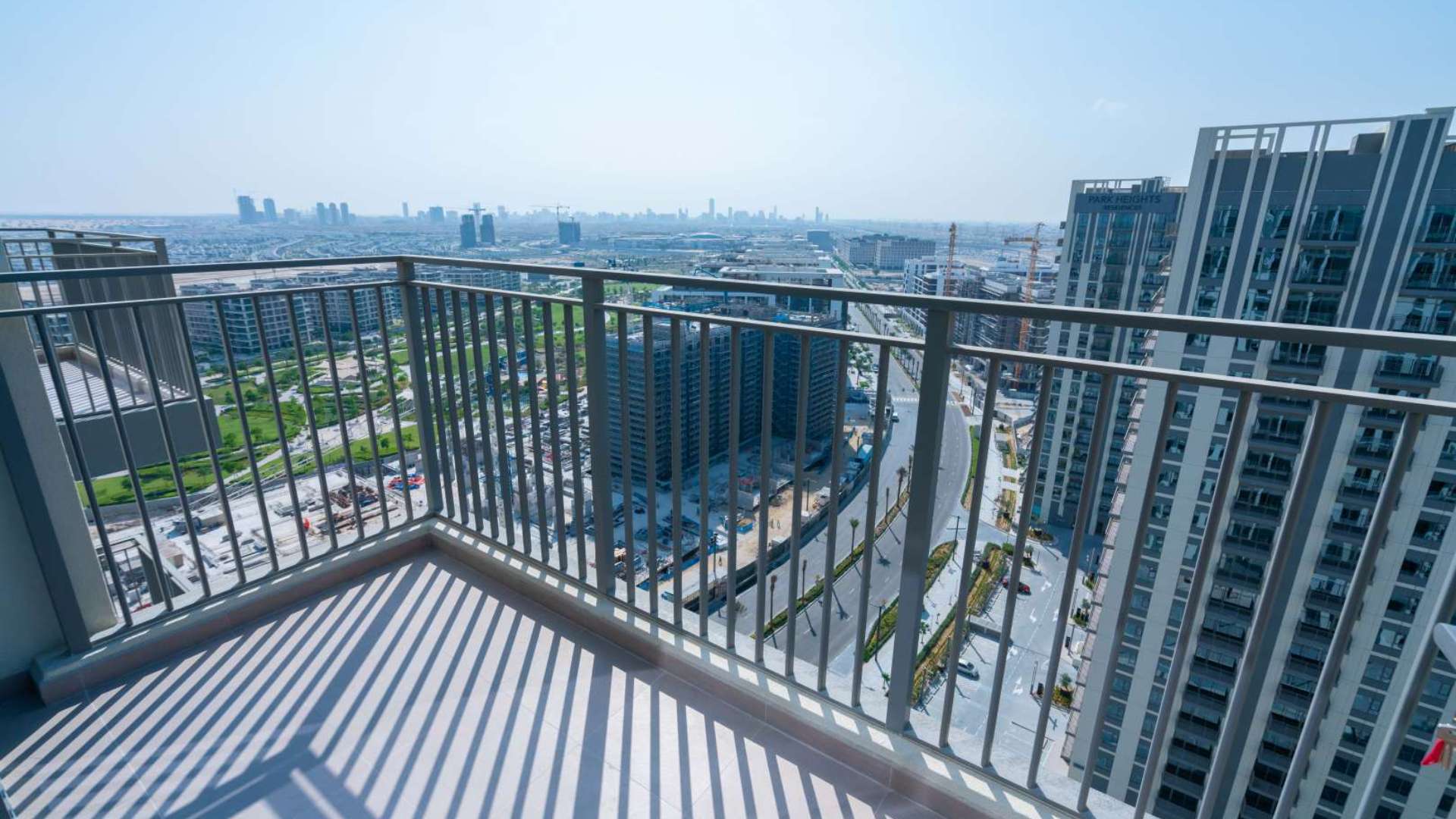 Alt text: "Balcony view from 3-bedroom apartment in Park Heights 2, Dubai Hills Estate.",Balcony view from 3-bedroom corner apartment in Park Heights 2, Dubai Hills Estate