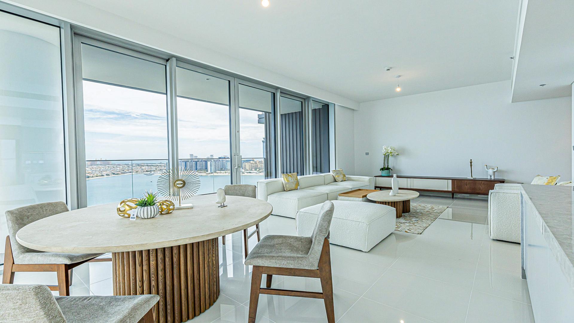 Emaar Beachfront apartment balcony with stunning Dubai Harbour sea view, elegant residential property