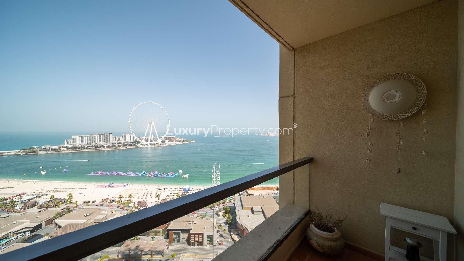 Balcony view from luxurious 3-bedroom apartment in Rimal 2, JBR, overlooking beach and Ferris wheel