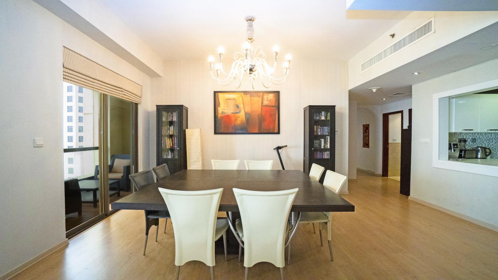 Spacious JBR apartment living room with Gulf views, modern decor, and large windows