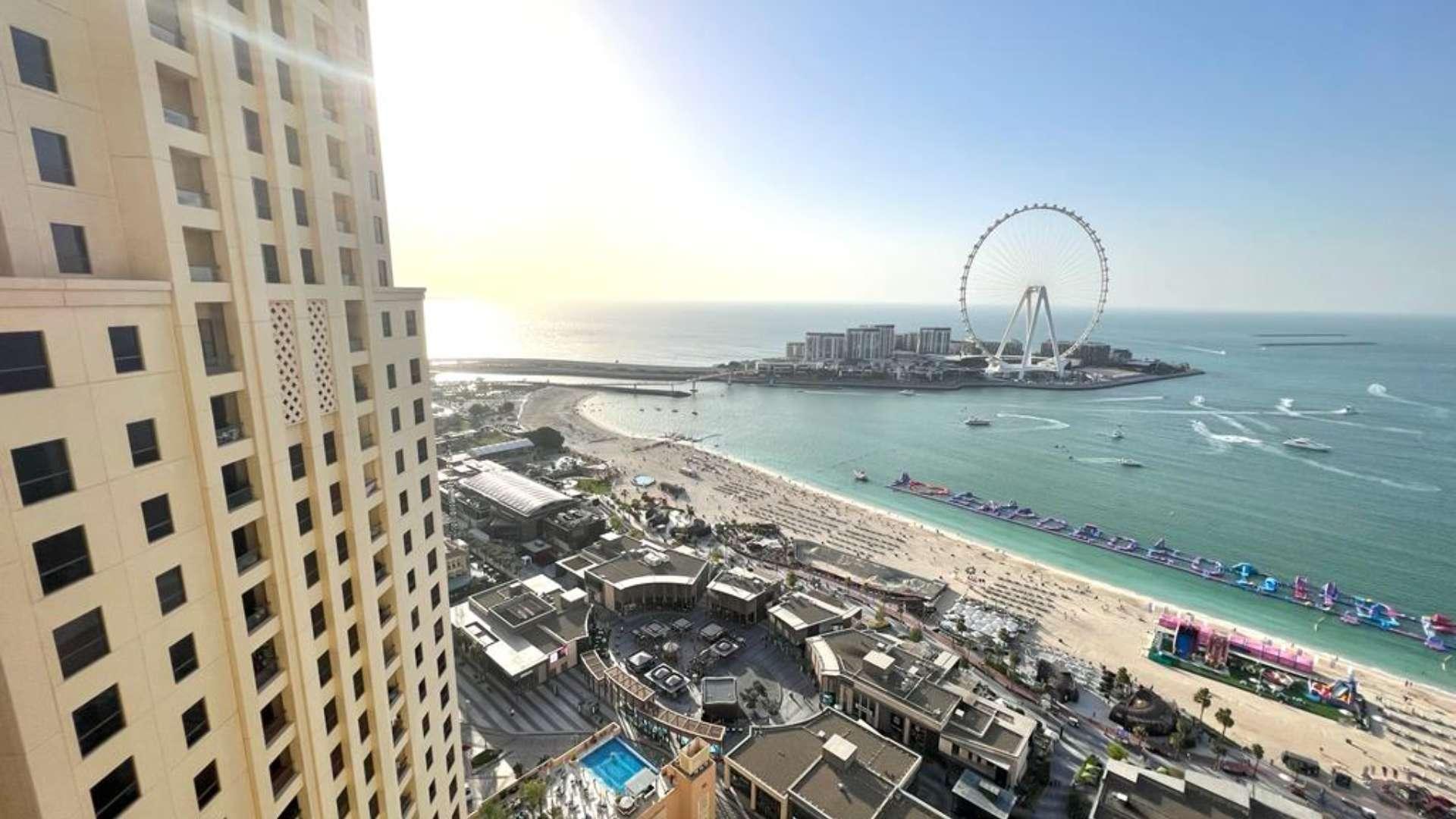 Beachfront view from 3-bedroom apartment in Rimal 5, JBR, overlooking sea and Ferris wheel