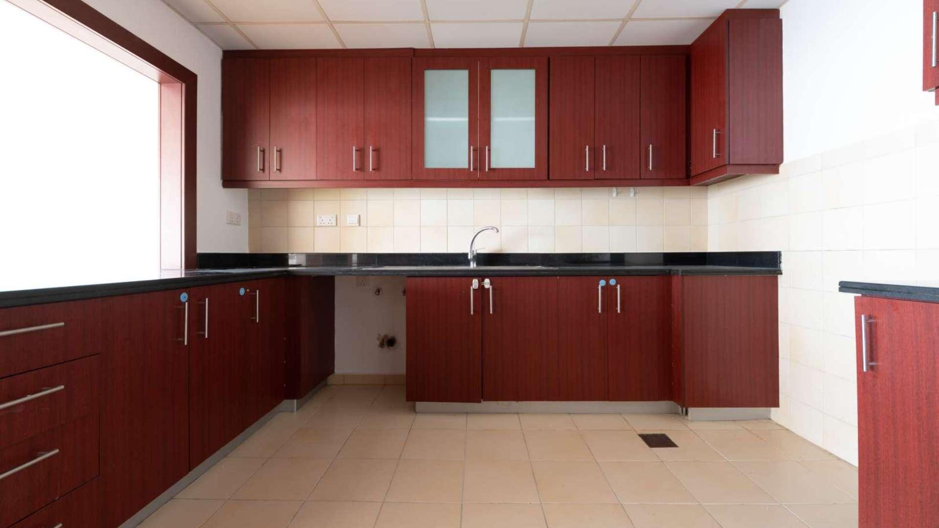 Modern kitchen in 3-bedroom beachfront apartment, Rimal 5, JBR, with elegant wooden cabinetry