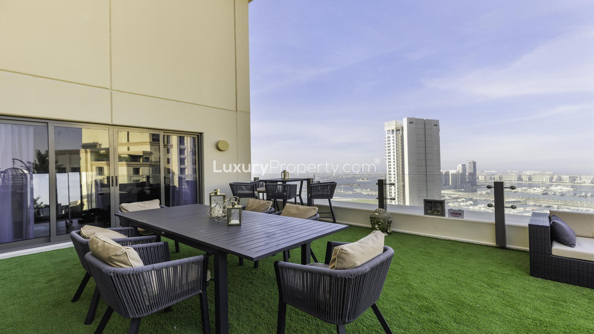 N/A,Large terrace with dining area and stunning views in Jumeirah Beach Residence apartment