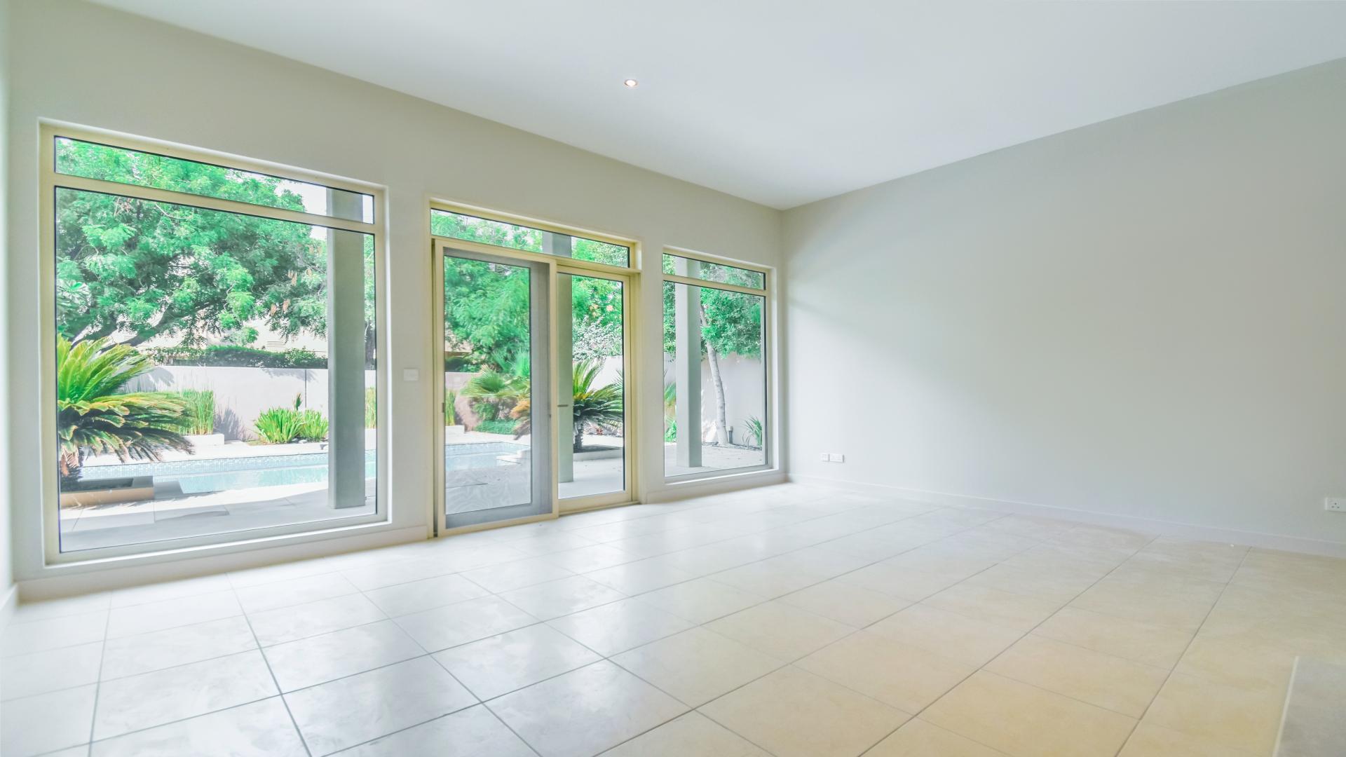 Spacious interior of corner plot villa in Saheel, Arabian Ranches with modern finishes and garden view