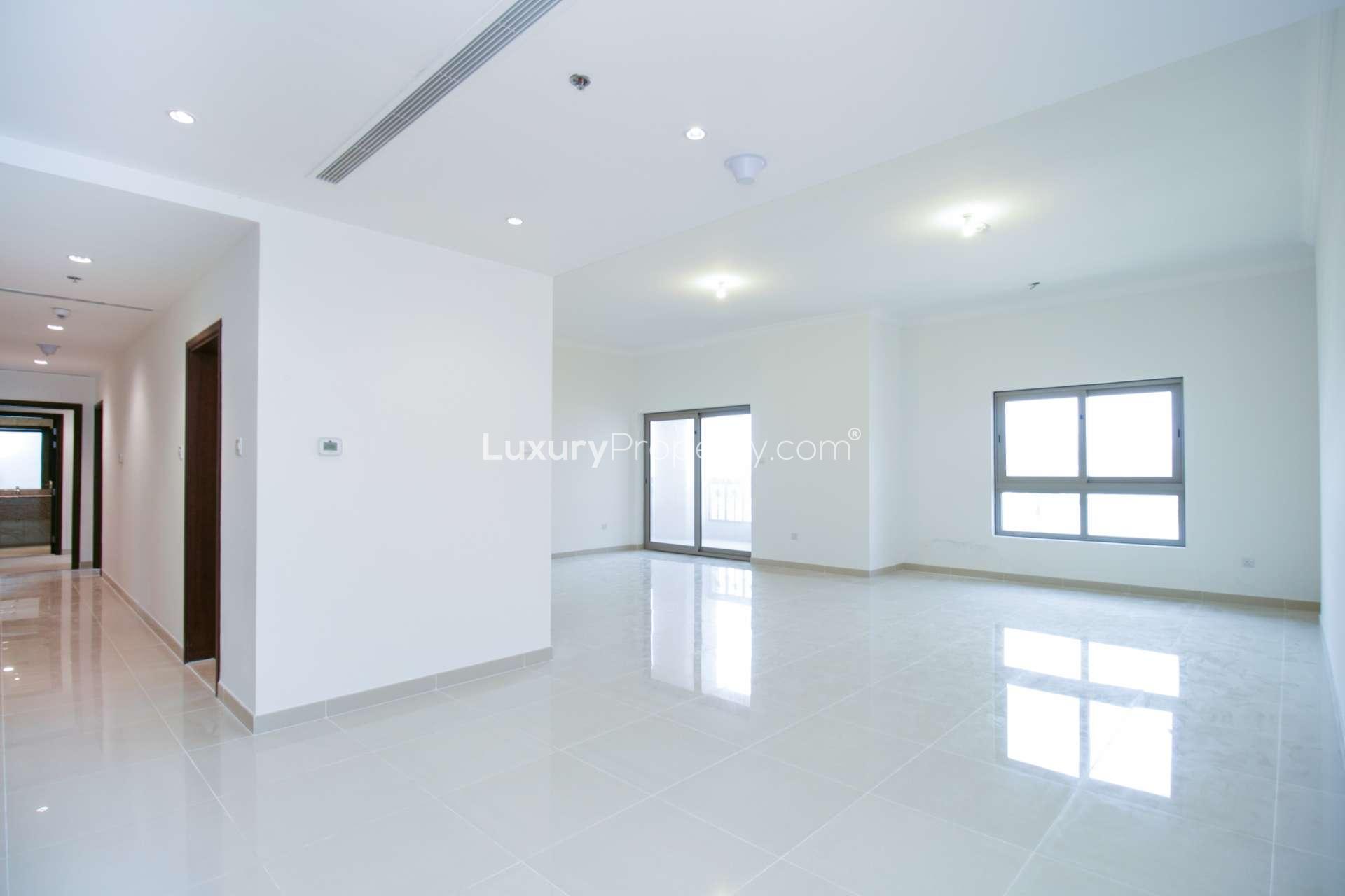 Empty room with built-in wooden wardrobe in beachfront apartment, Sarai Apartments, Palm Jumeirah