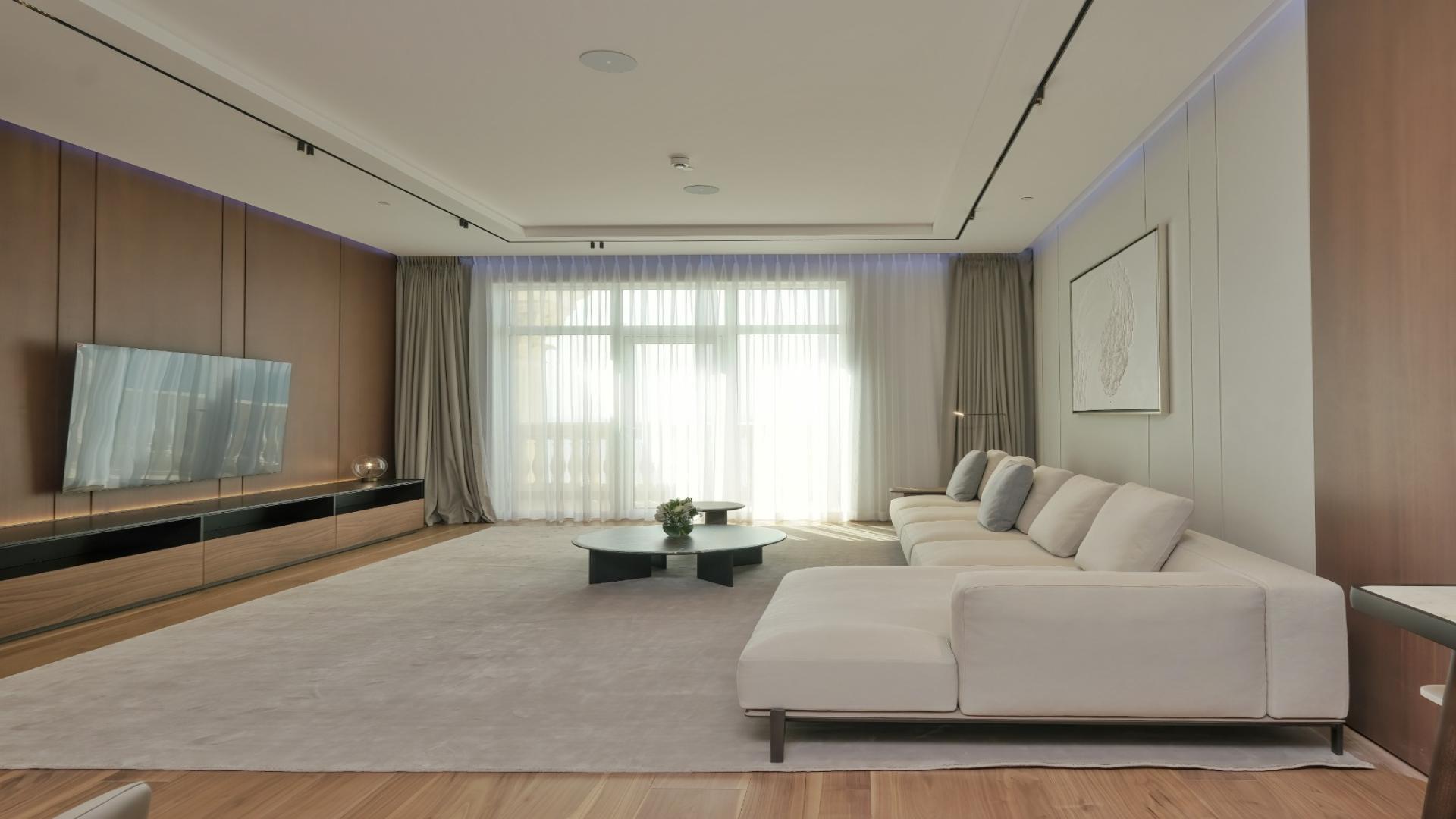 Luxurious dining and living area in 3-bedroom apartment, Raffles Residences, Palm Jumeirah