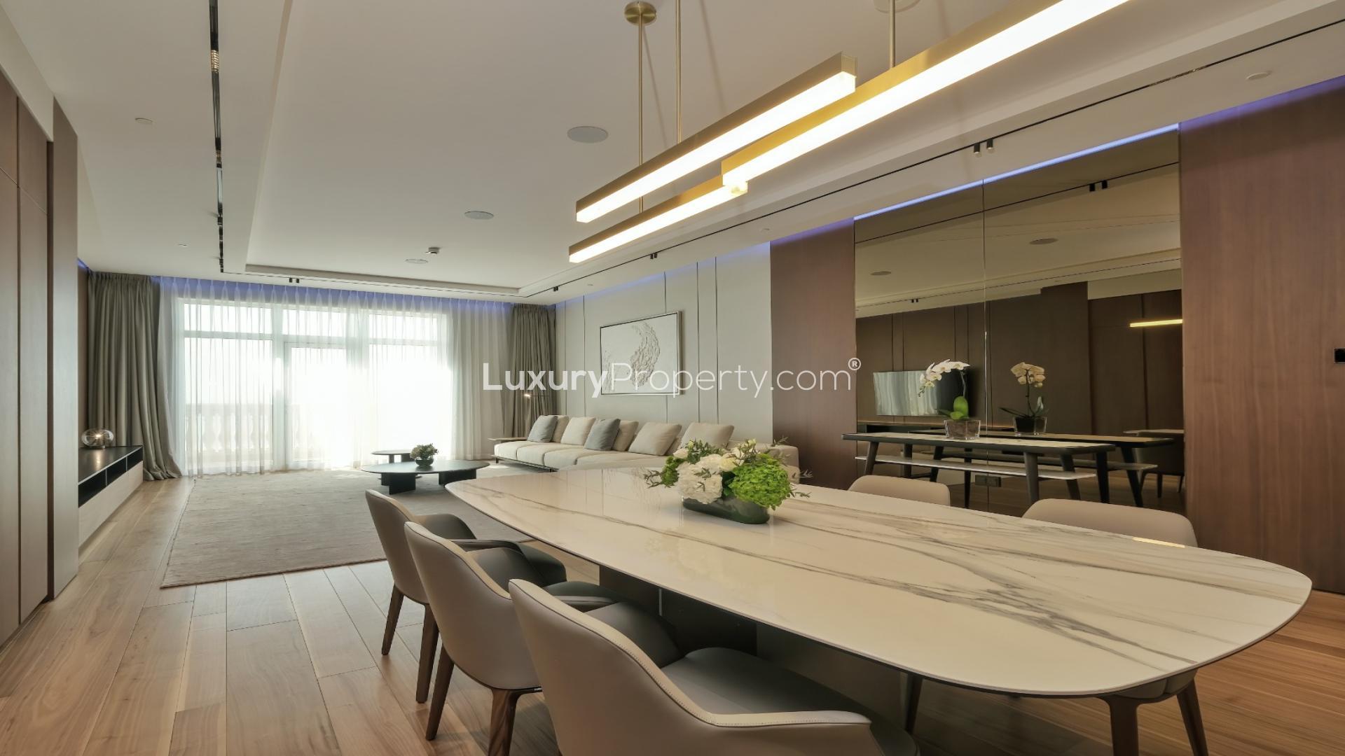 Modern living and dining area in 3-bedroom Palm Jumeirah apartment, Raffles Residences