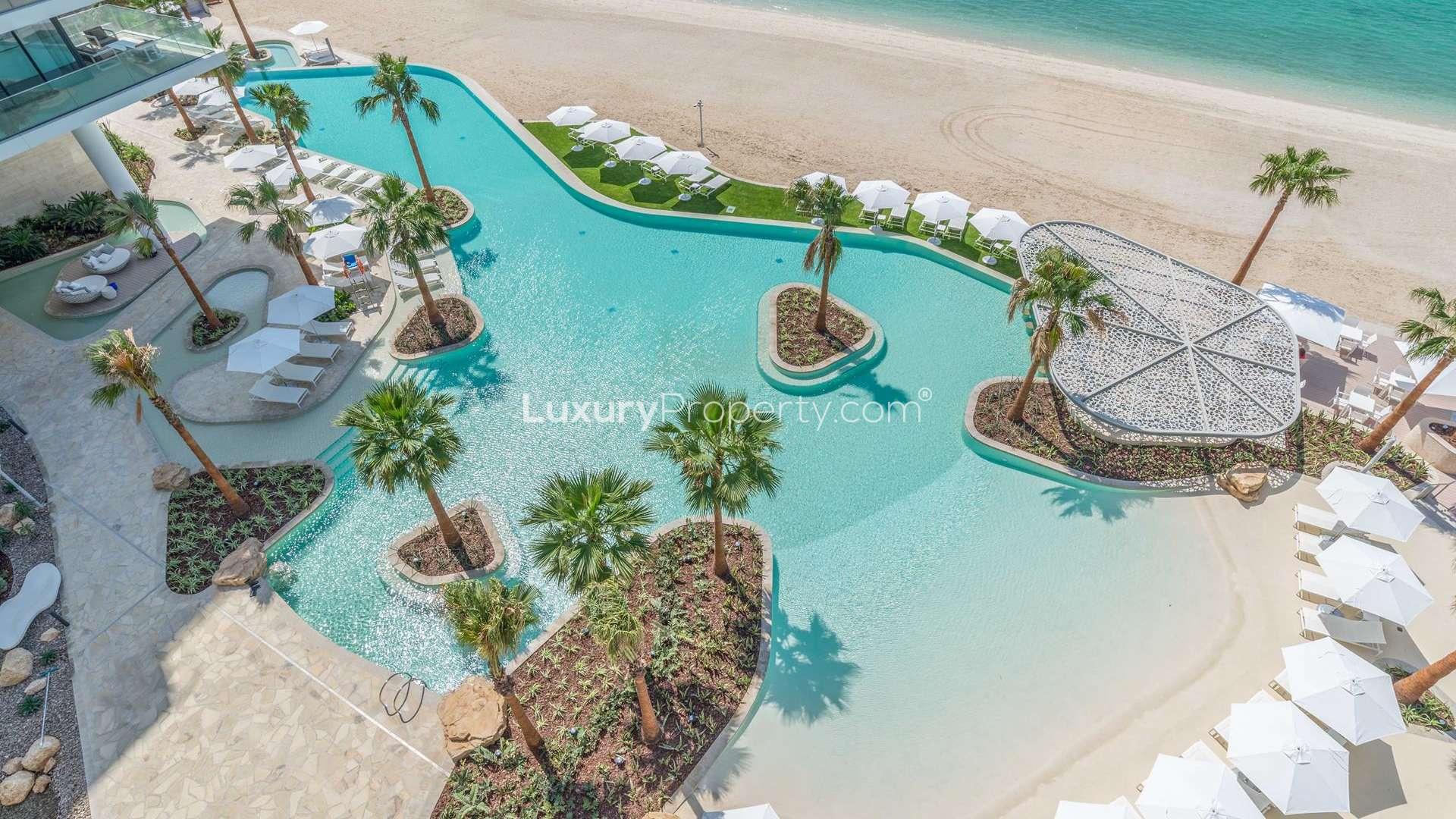 "Stunning sea view from apartment balcony at Serenia Residences, Palm Jumeirah.",Luxurious poolside view at Serenia Residences, Palm Jumeirah, near pristine beach