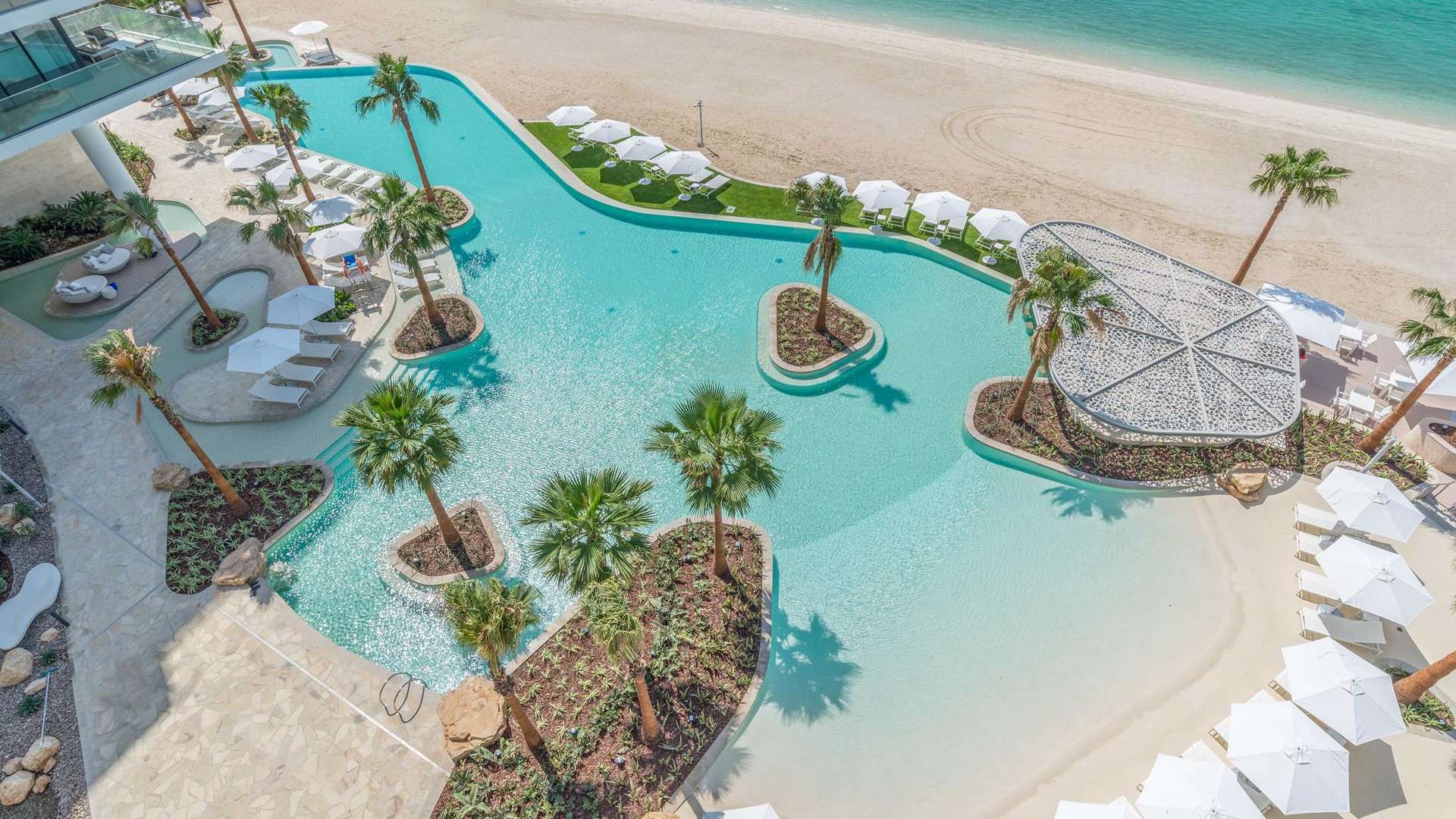 "Stunning sea view from apartment balcony at Serenia Residences, Palm Jumeirah.",Luxurious poolside view at Serenia Residences, Palm Jumeirah, near pristine beach