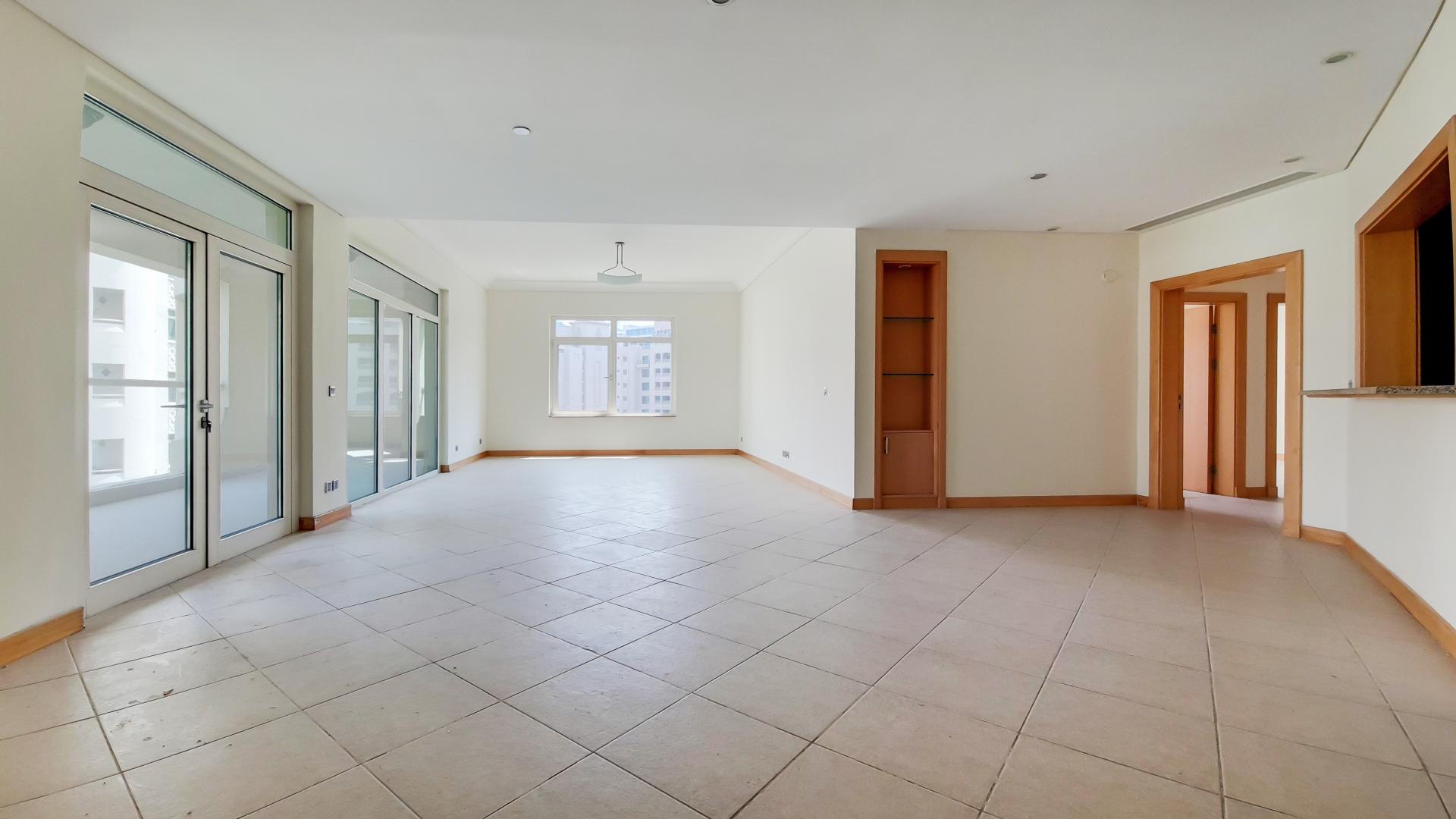 Mid-floor apartment view in Shoreline Apartments, Palm Jumeirah, showing sea glimpses and road