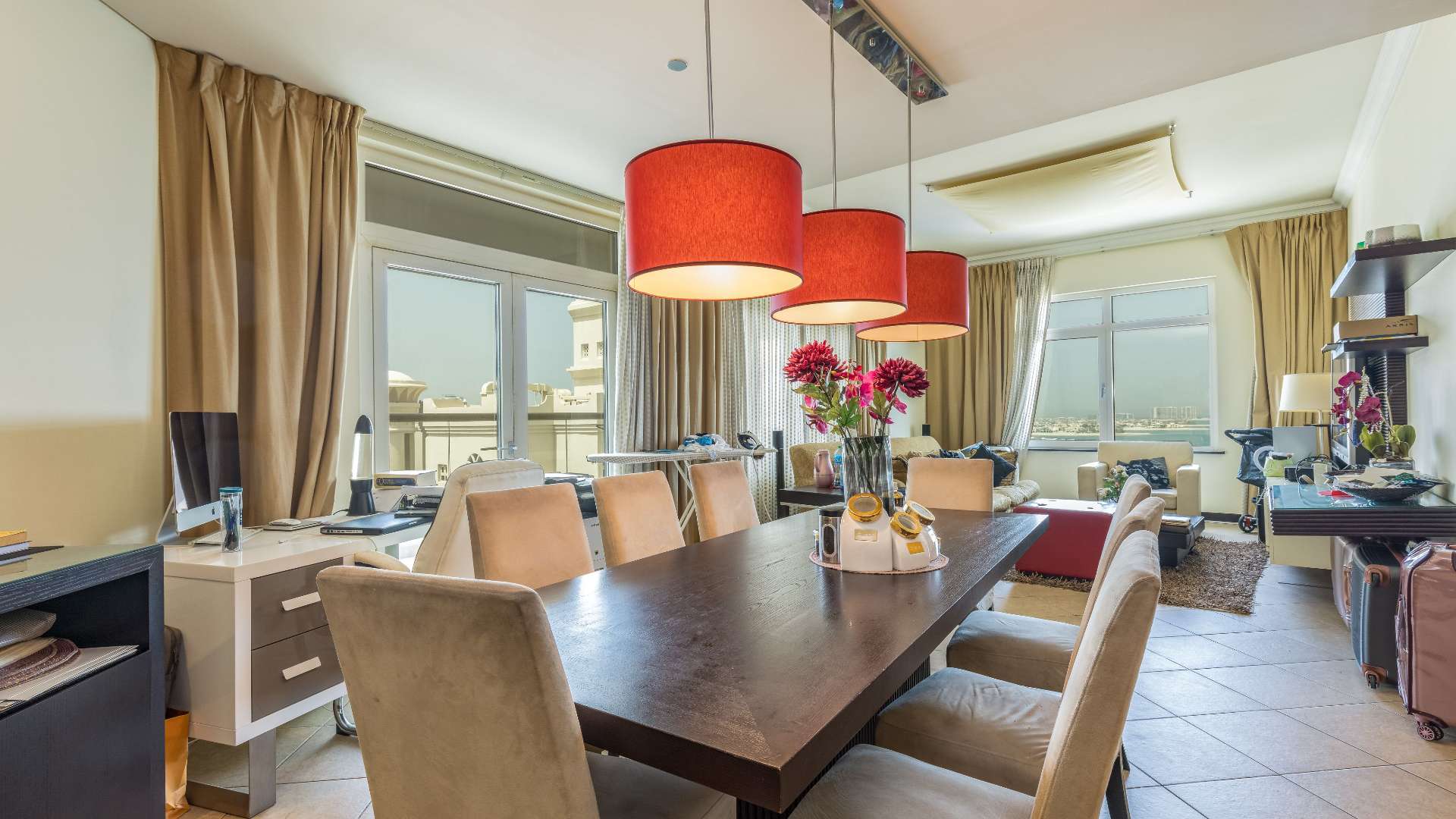 "Stunning sea view from Shoreline Apartments, Palm Jumeirah with pool and beach access.",Dining area with sea view in Palm Jumeirah Shoreline apartment for sale