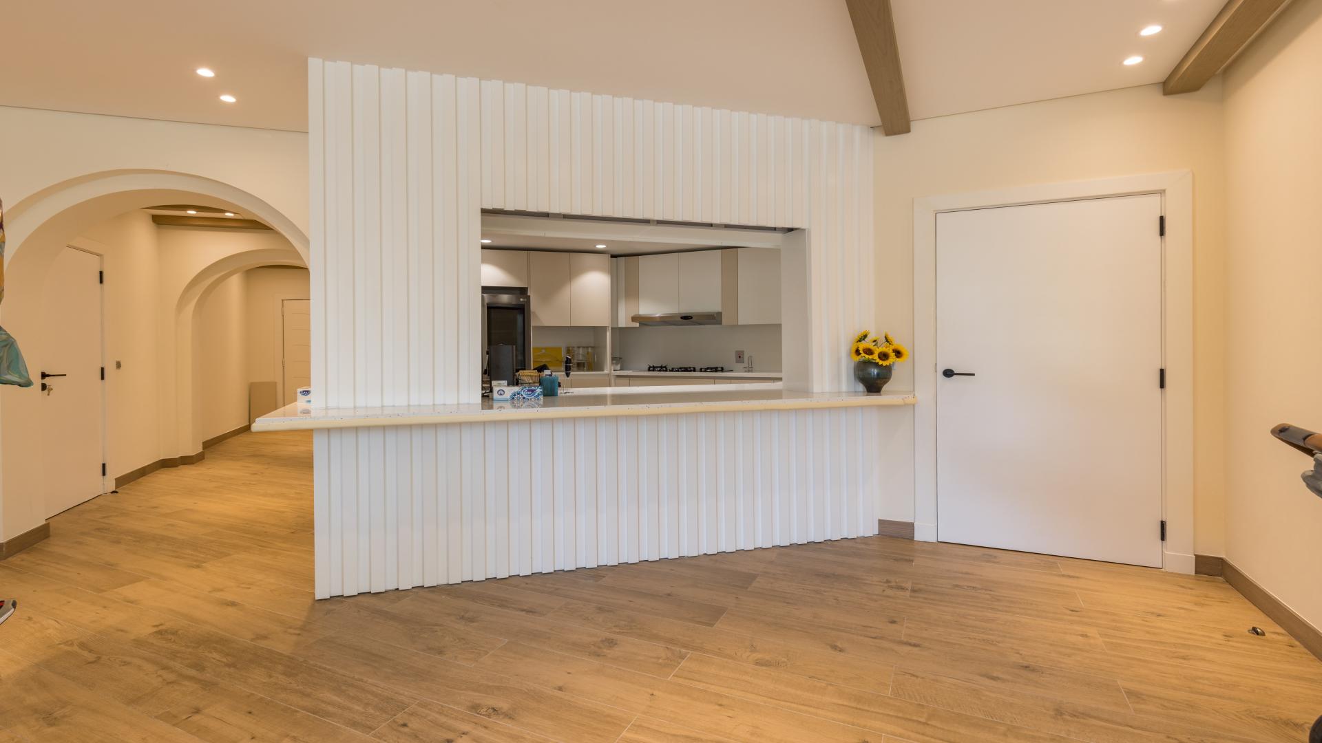 Living room in upgraded Palm Jumeirah apartment with modern decor and garden views