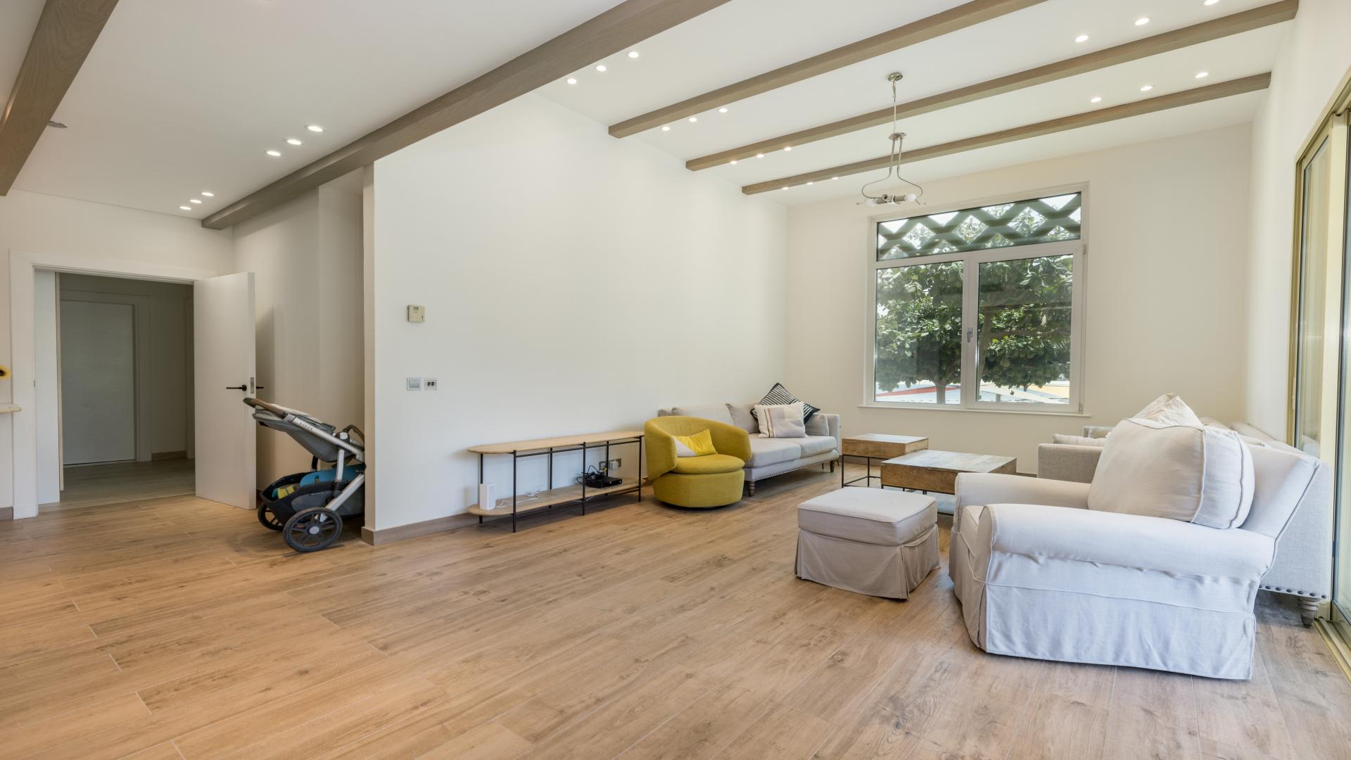 Upgraded kitchen in Shoreline Apartments, Palm Jumeirah, with modern design and wood flooring