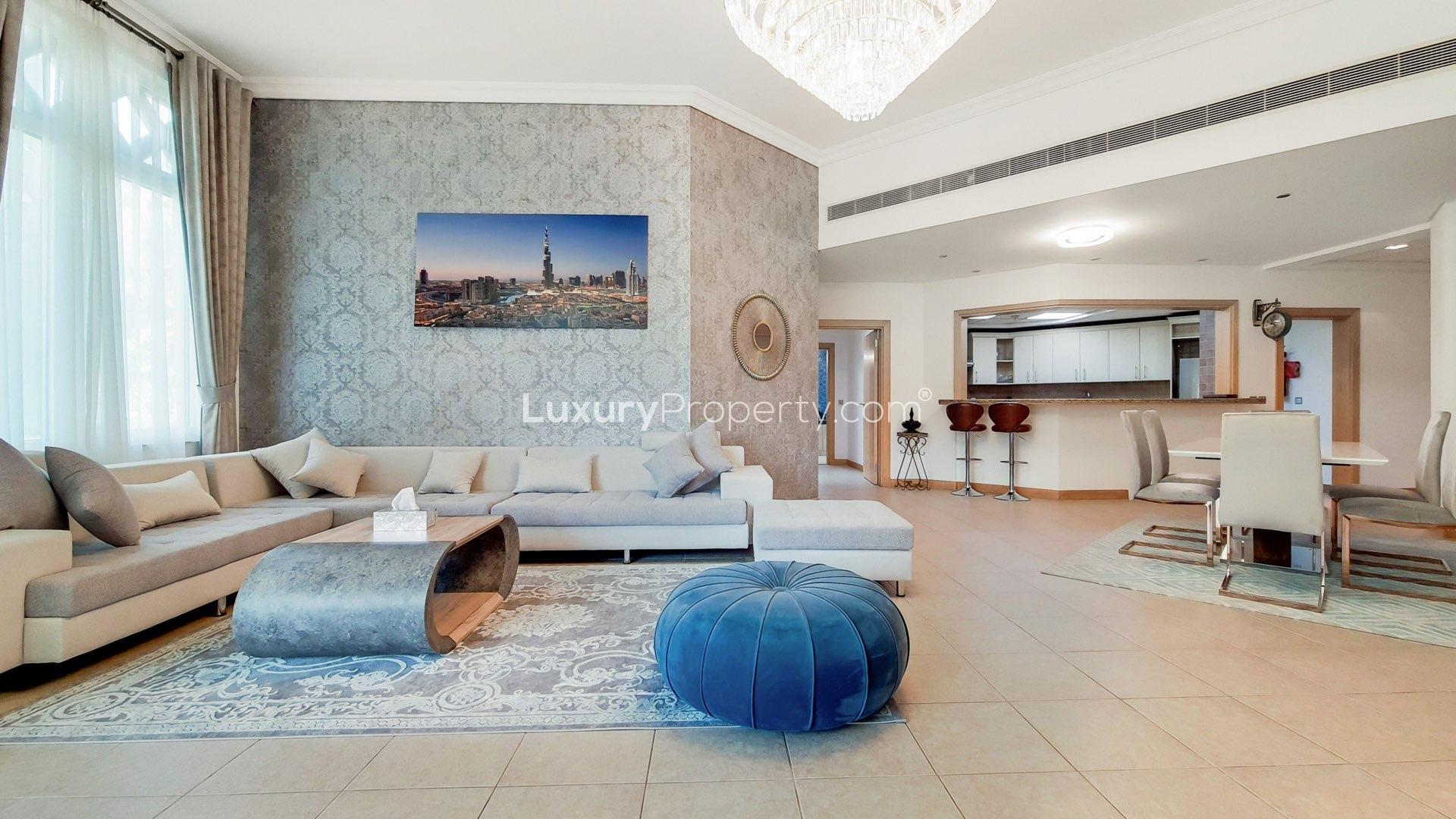 Spacious living room in Palm Jumeirah apartment, featuring elegant decor and modern furnishings