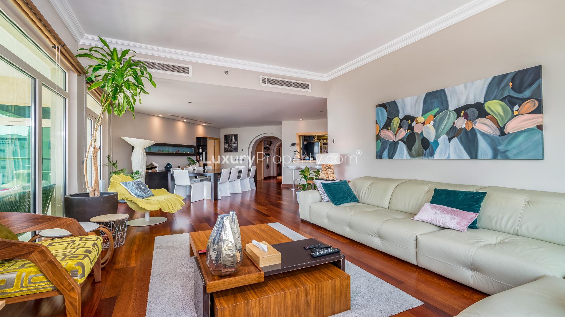 "High-floor apartment sea view from Shoreline Apartments, Palm Jumeirah, Dubai, for sale.",High floor apartment living room with modern decor, Palm Jumeirah Shoreline Apartments