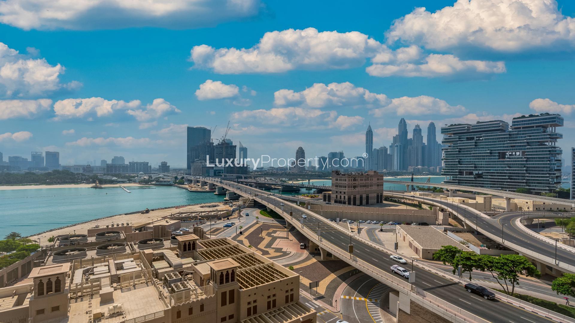 High floor apartment view of Palm Jumeirah shoreline and city skyline, Dubai