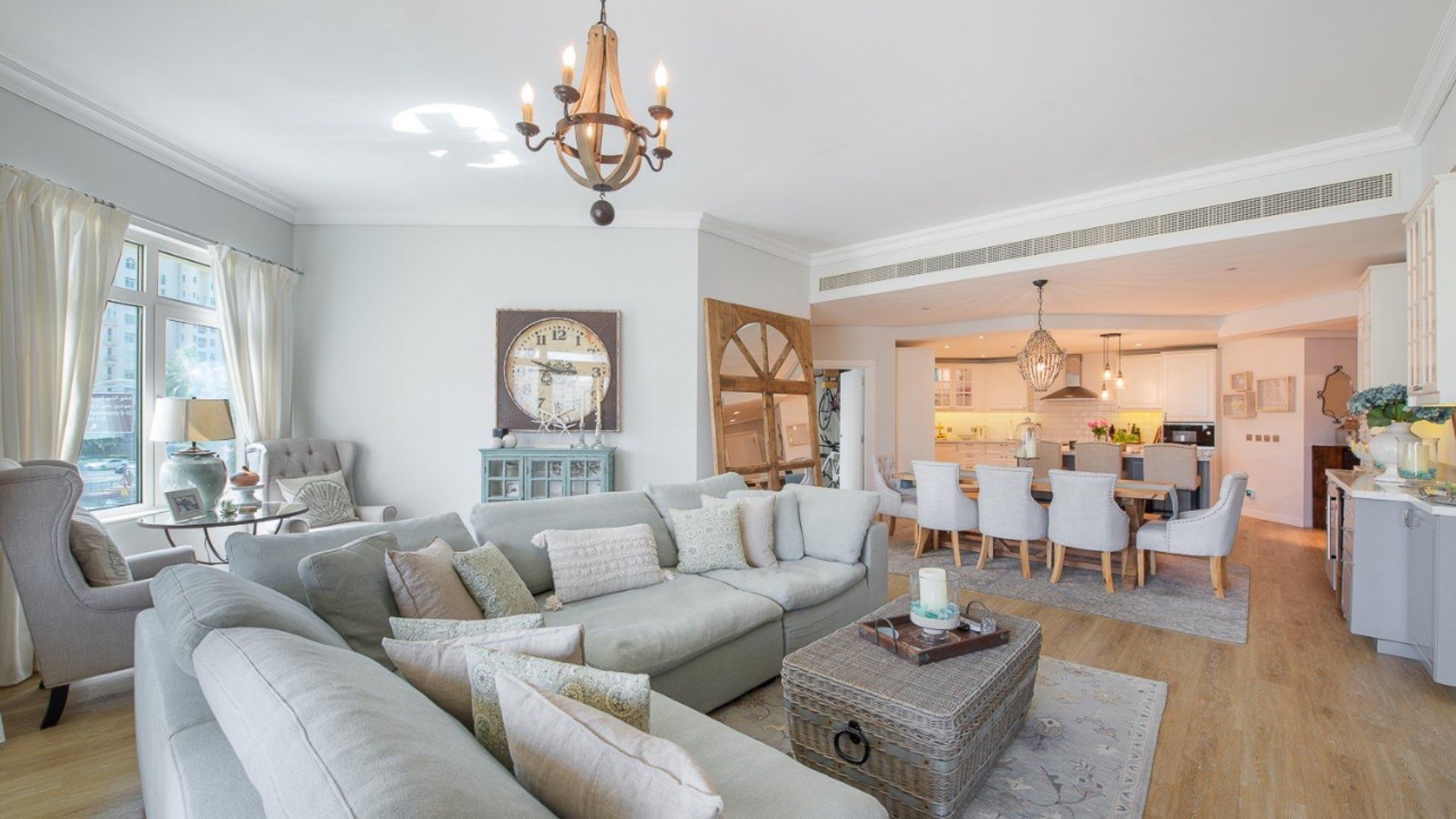 Upgraded Palm Jumeirah Shoreline apartment dining and living area with modern decor and lighting