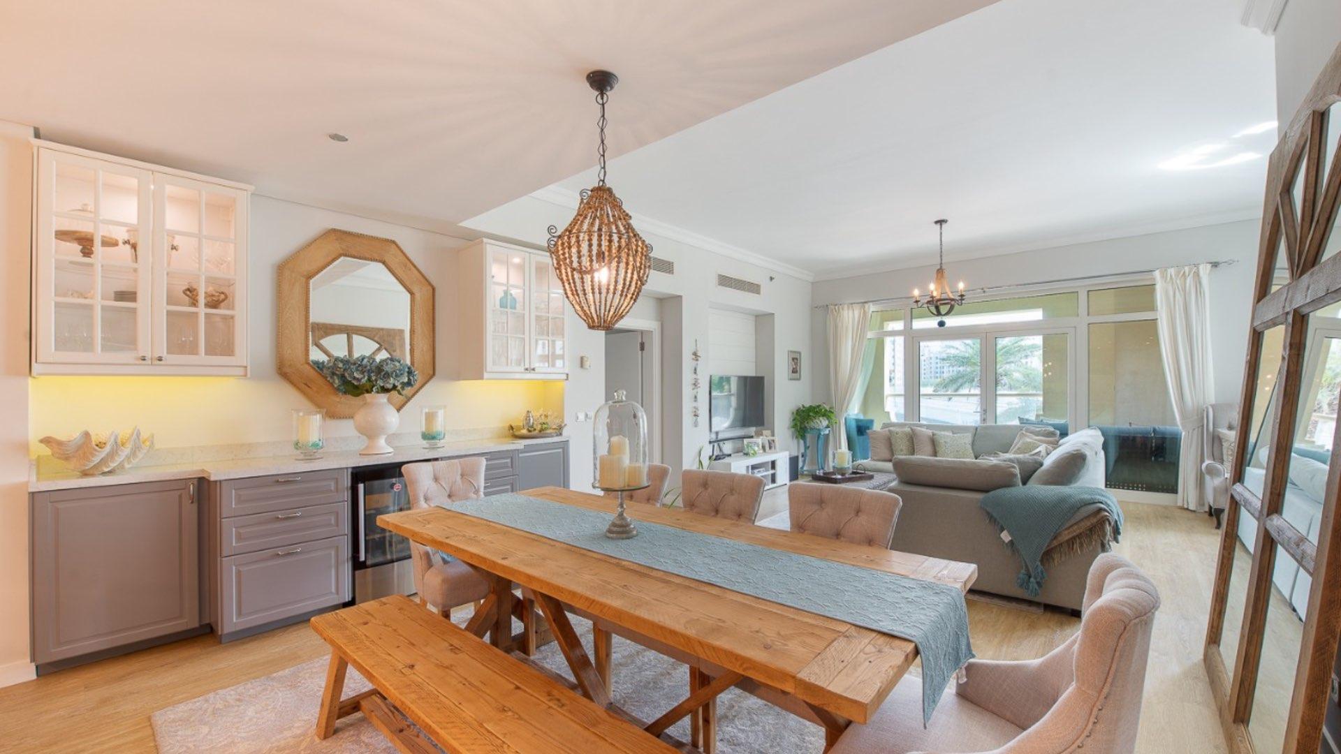 Modern kitchen in upgraded Shoreline apartment, Palm Jumeirah, featuring elegant design and appliances