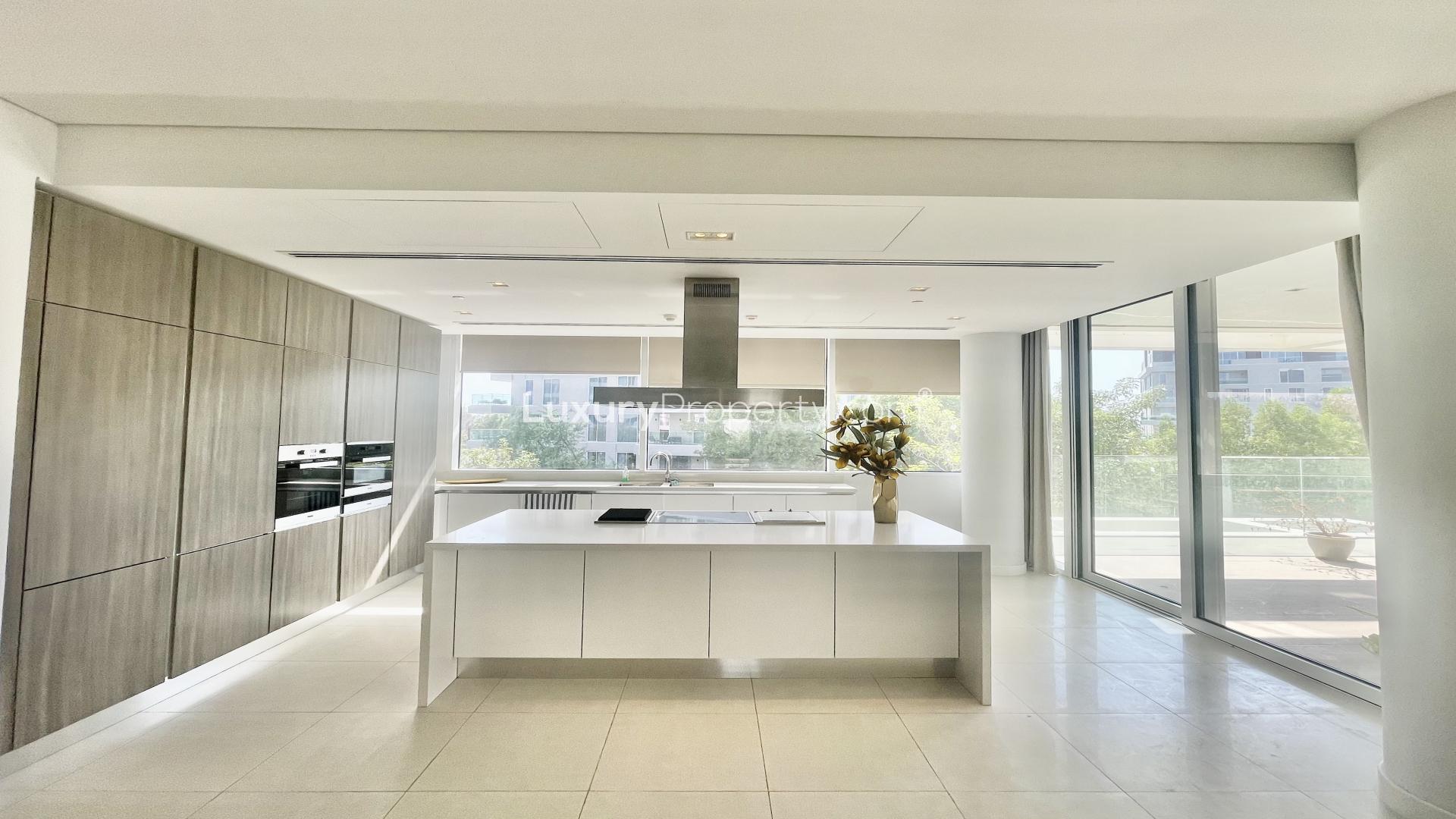 Modern kitchen in luxurious 3-bedroom apartment, Ashjar, Al Barari, featuring sleek design and appliances