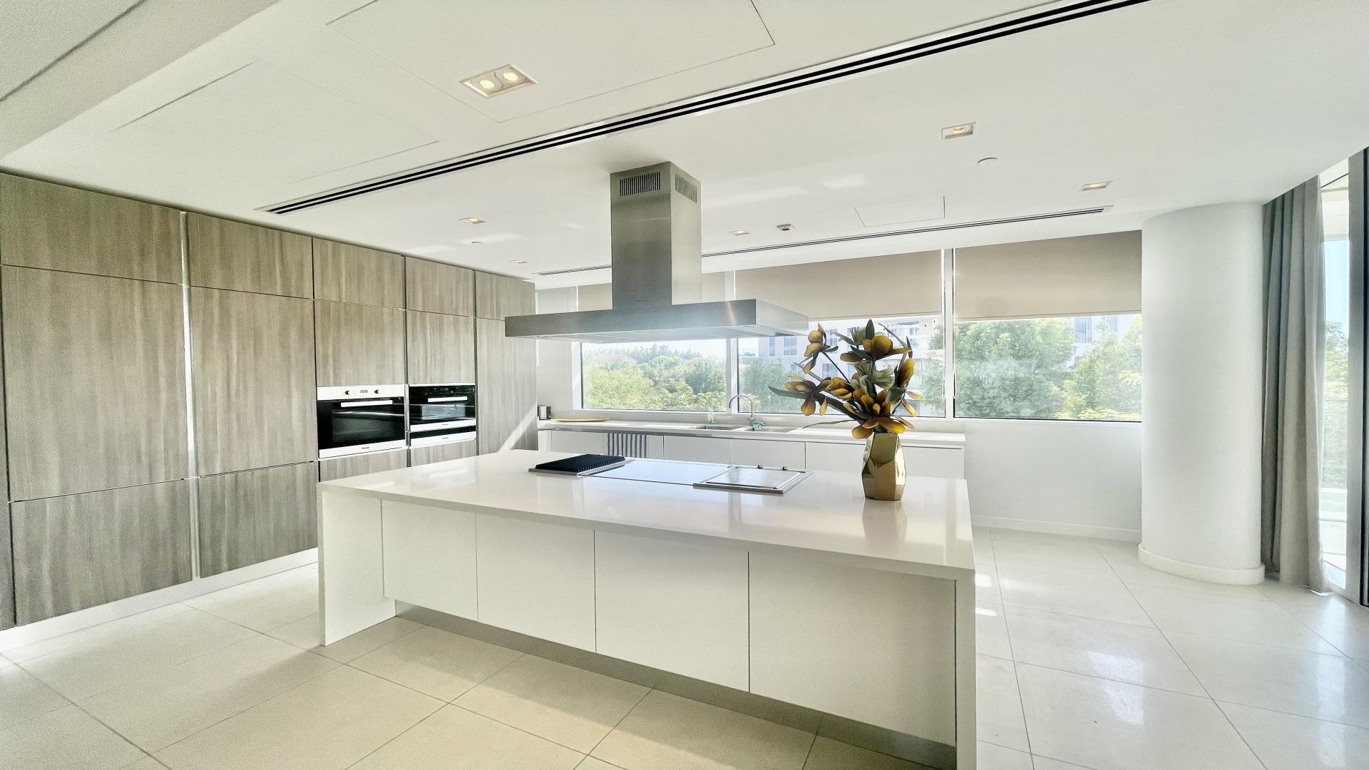 Luxurious modern kitchen with island in 3-bedroom apartment, Ashjar, Al Barari, for sale