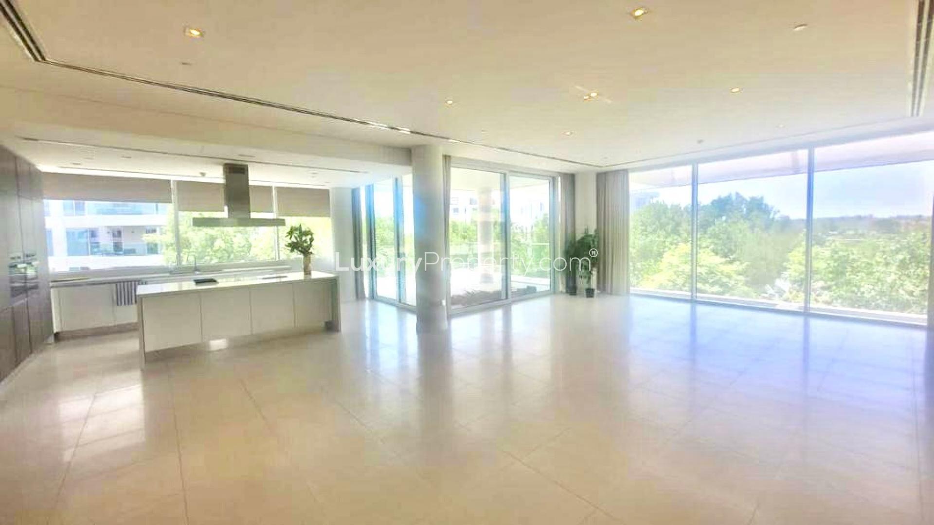 Luxurious modern kitchen in 3-bedroom apartment, Ashjar, Al Barari, with sleek design and greenery views