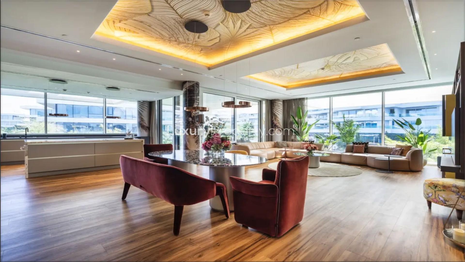 Modern living room in Al Barari smart home, featuring elegant decor and spacious design