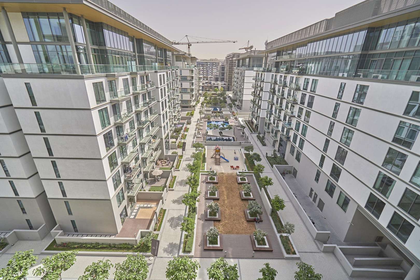 Aerial view of Hartland Greens apartment complex in Sobha Hartland, Mohammed Bin Rashid City