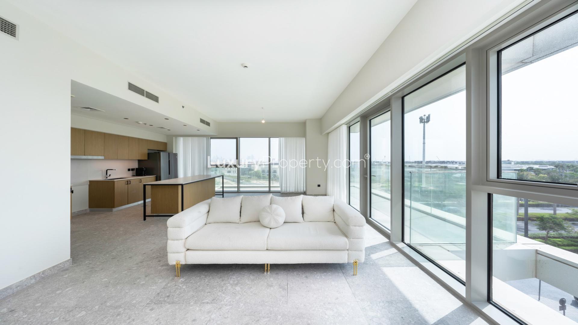 "Spacious balcony view from 3-bedroom apartment in Golf Suites, Dubai Hills Estate for sale.",Bright living area in 3-bedroom apartment, Golf Suites, Dubai Hills Estate, with modern kitchen