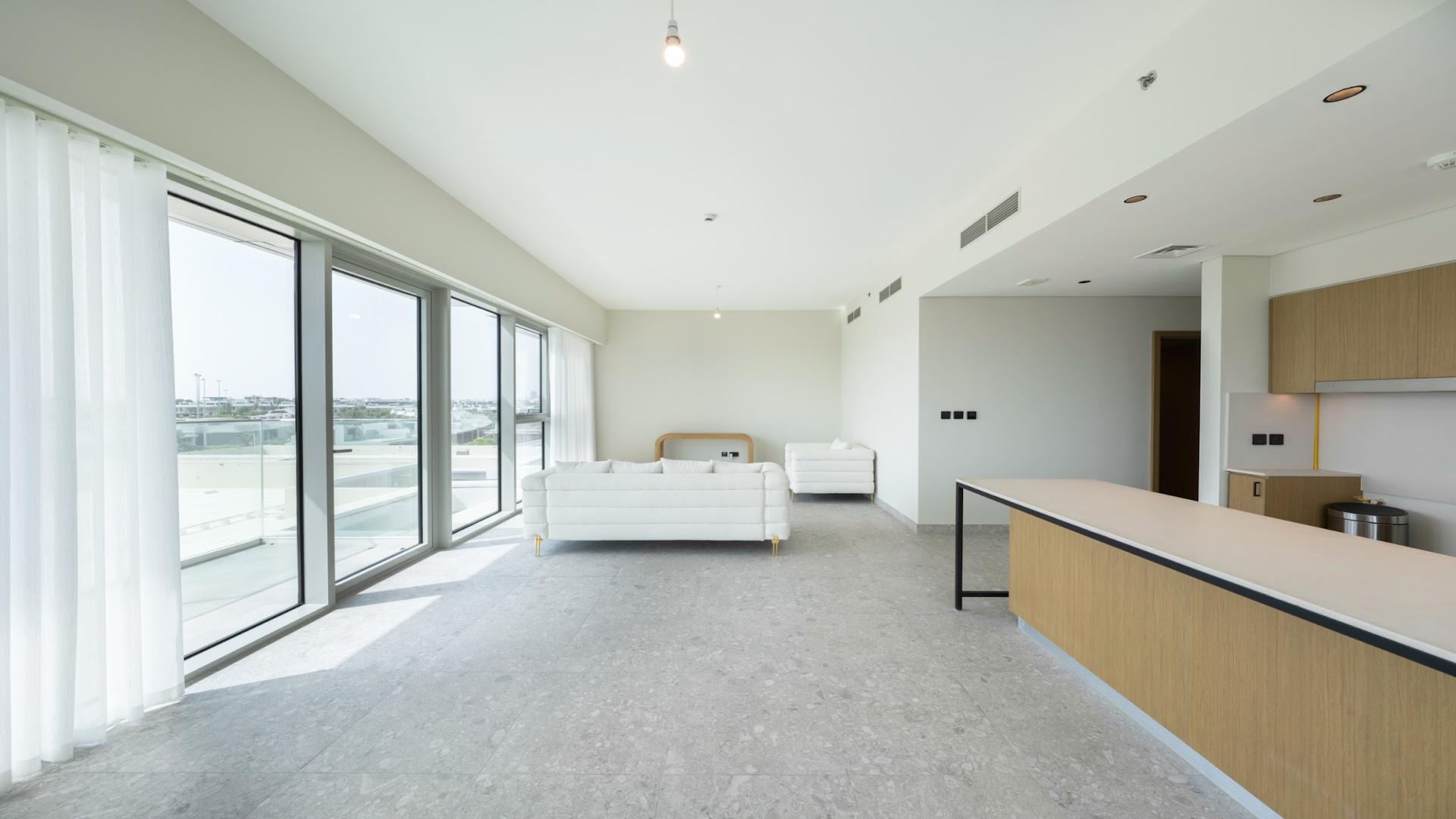 Bright living area in 3-bedroom apartment, Golf Suites, Dubai Hills Estate, large windows, modern design